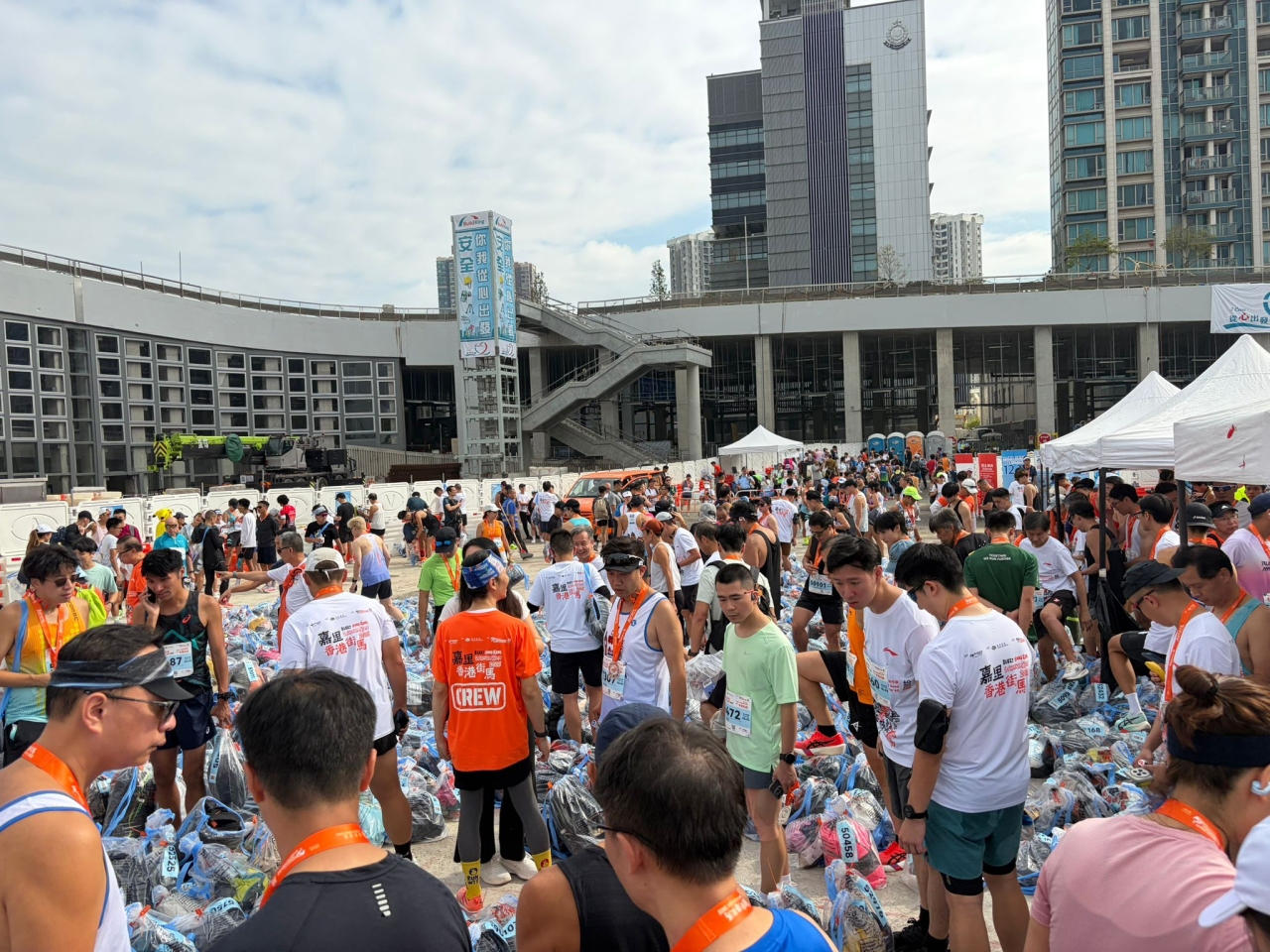 Runners were seen searching through bags piled up on the ground to retrieve their belongings. File photo provided by runners