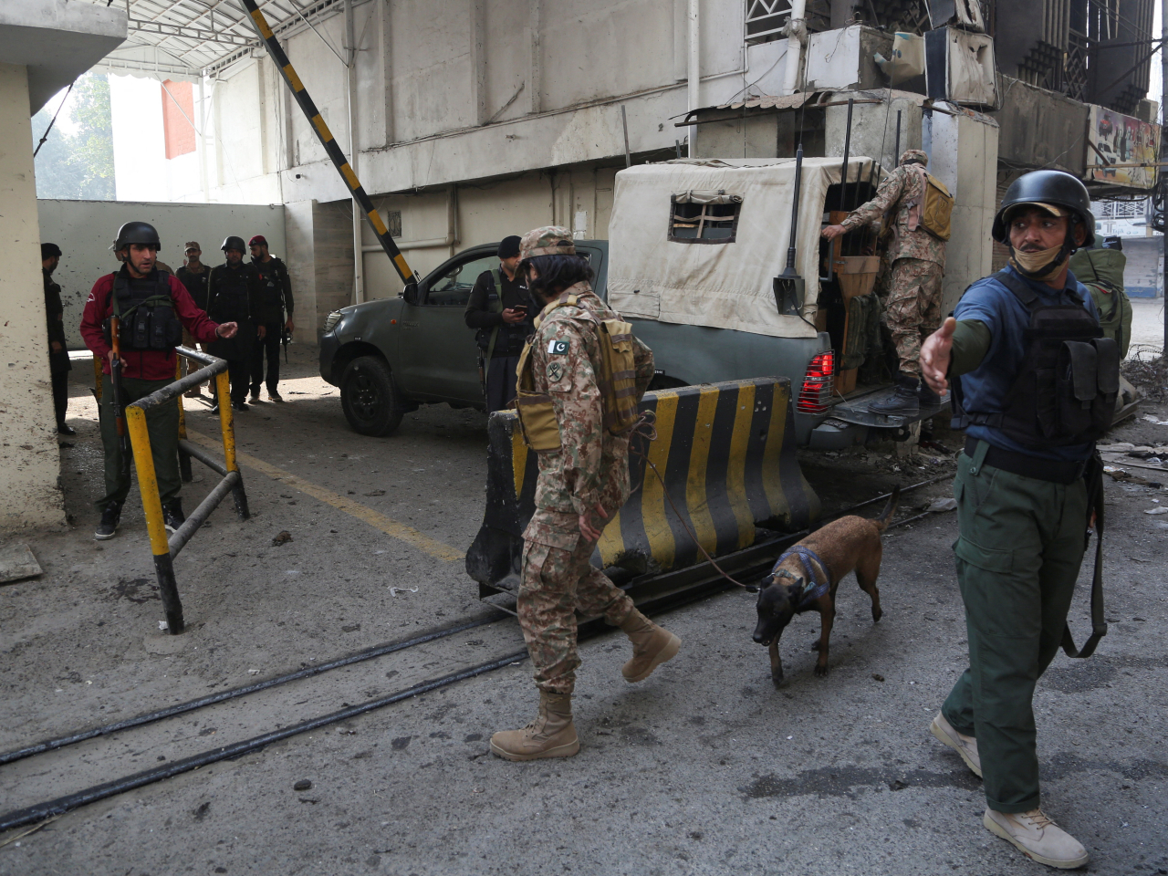Army soldiers secure the entrance to the Federal Constabulary headquarters in Peshawar following the suicide bombing attack. Photo: Reuters