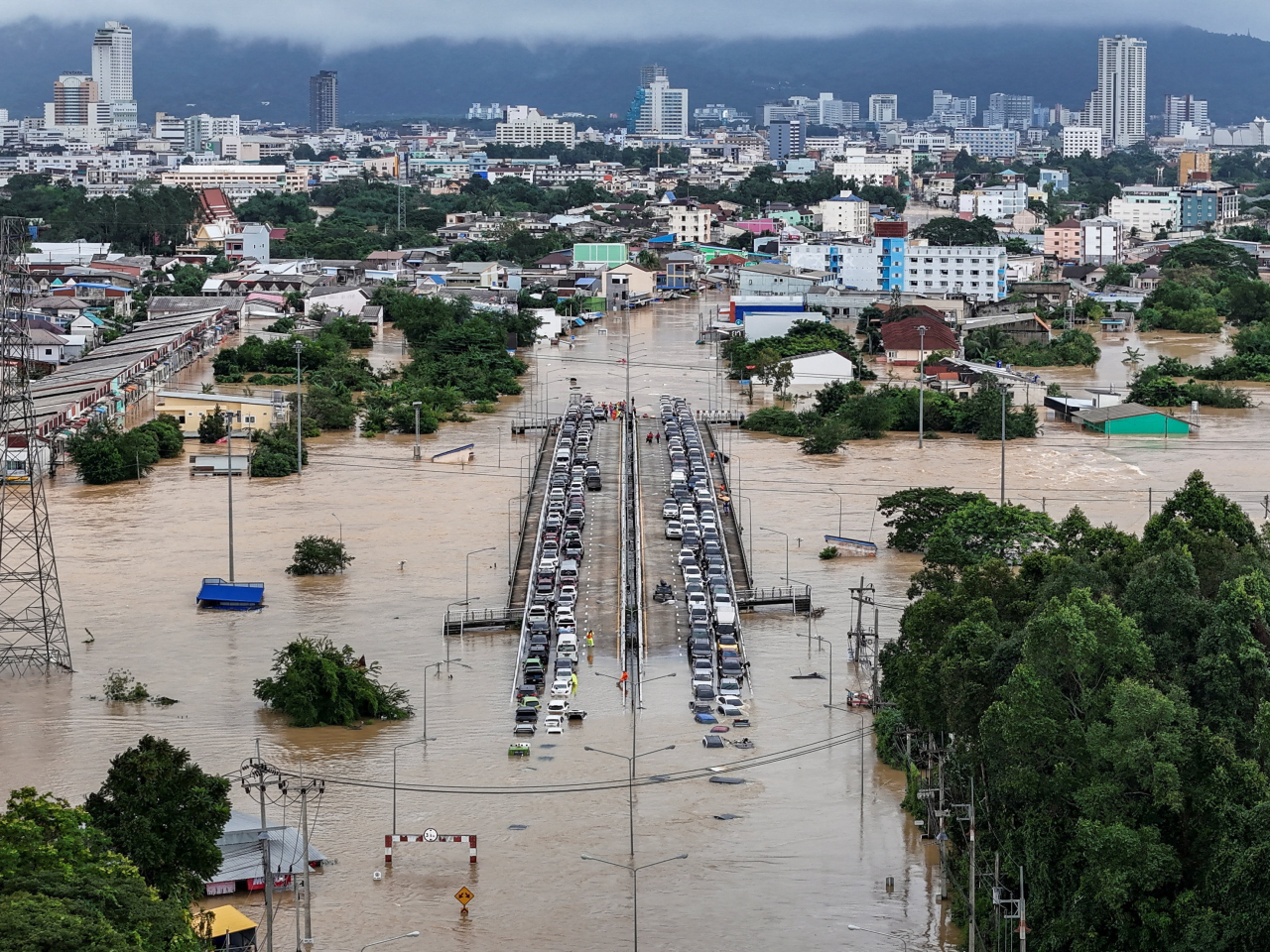 A drone view shows cars on a bridge in a flooded area in Hat Yai district, affected by heavy rainfall, which has impacted southern Thailand and Malaysia. Photo: Reuters
