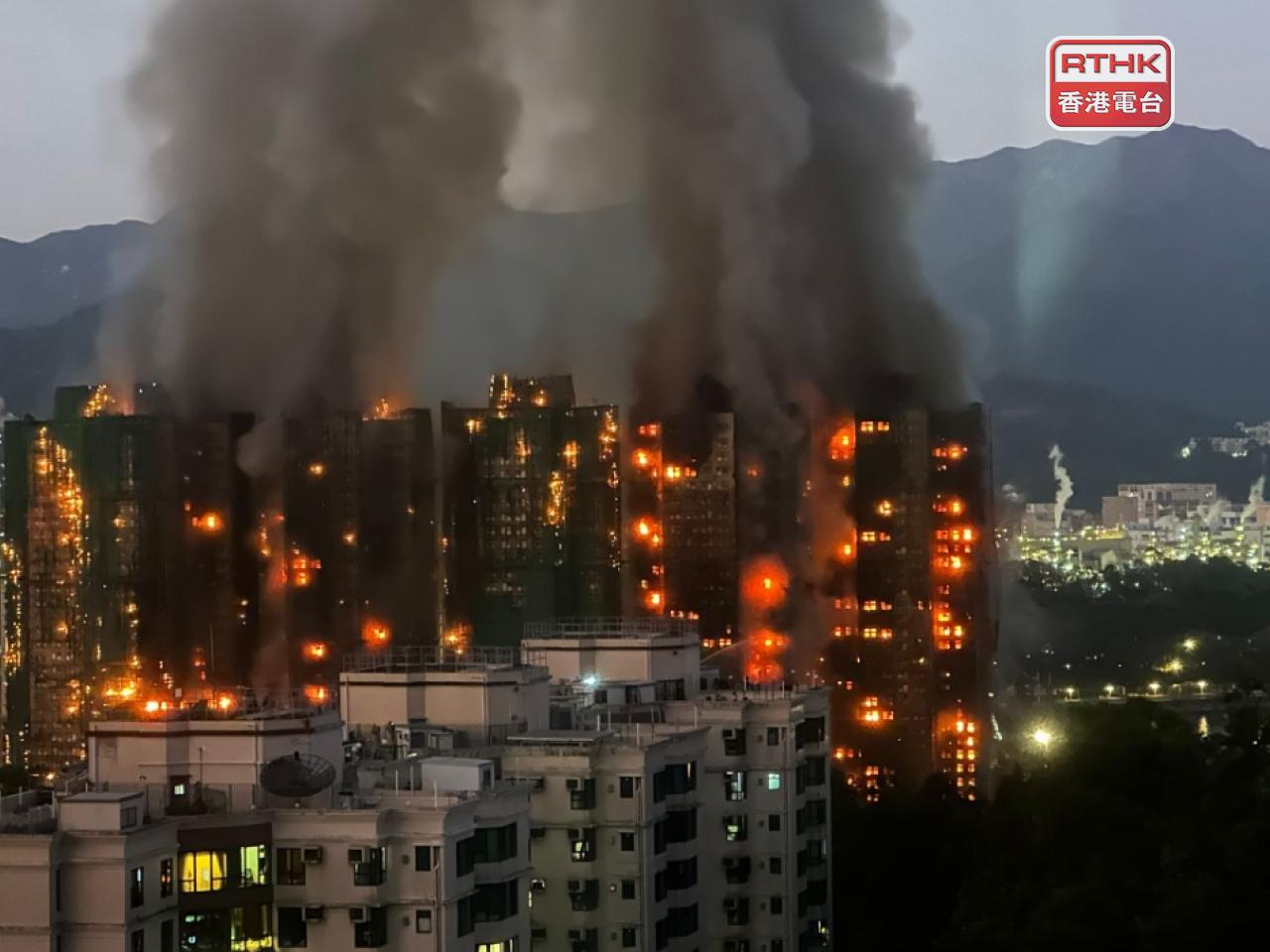 Several blocks were still ablaze hours after fire broke out at Wang Fuk Court, Tai Po. Photo: RTHK