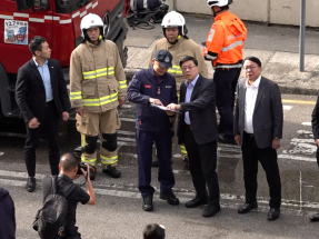 John Lee inspects scene of deadly fire