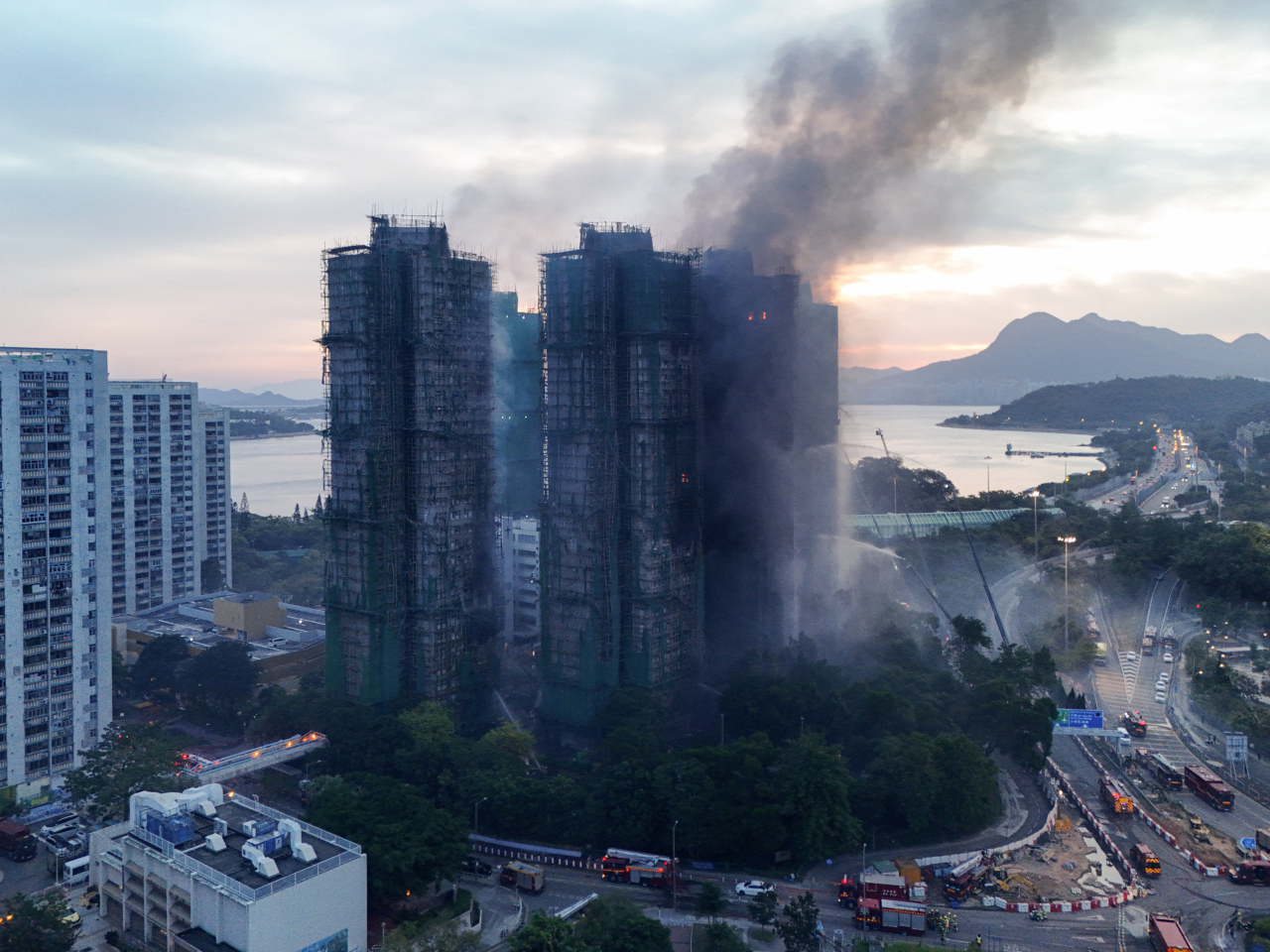 Tai Po FC wore black arm bands and stood in silence in Sydney in solidarity with victims and survivors of the Wang Fuk Court fire. Photo: Reuters