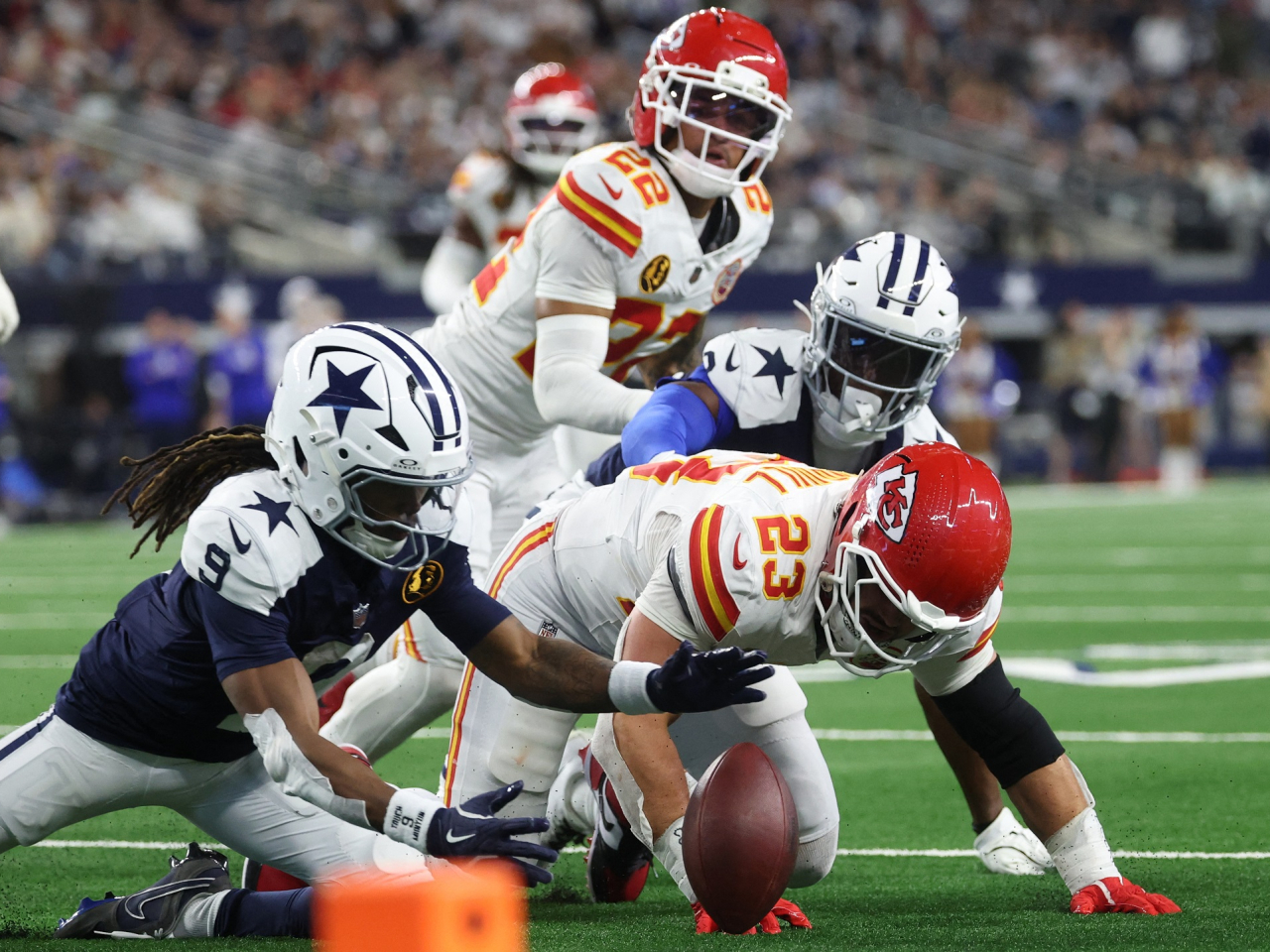 Cowboys wide receiver KaVontae Turpin, left, and Chiefs linebacker Drue Tranquill look to recover a fumble during the fourth quarter in the game won by Dallas. Photo: Kevin Jairaj-Imagn Images via Reuters