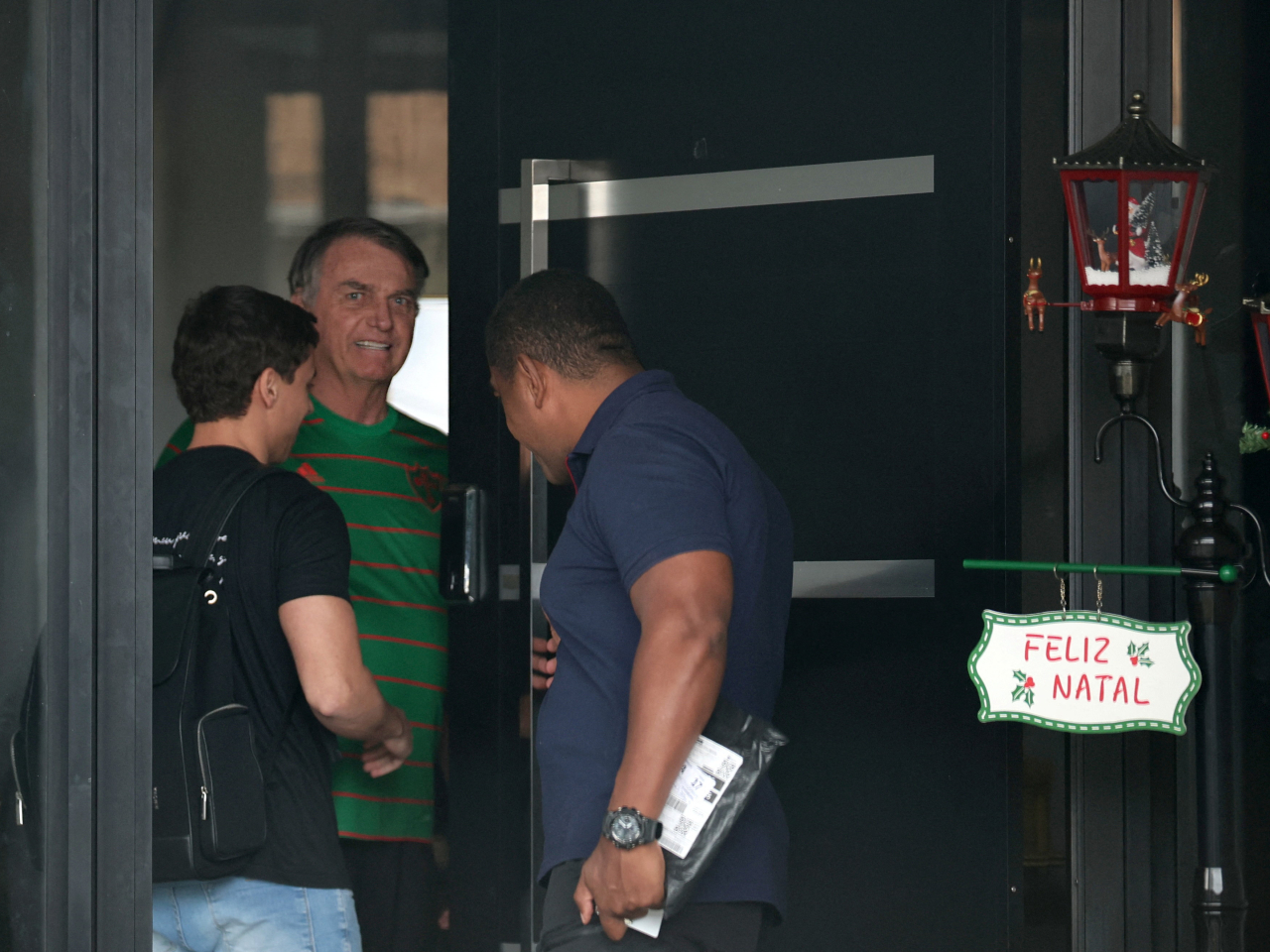 Jair Bolsonaro is visited by police during house arrest on the day before being detained for tampering with his ankle monitor with a soldering iron. File photo: Reuters
