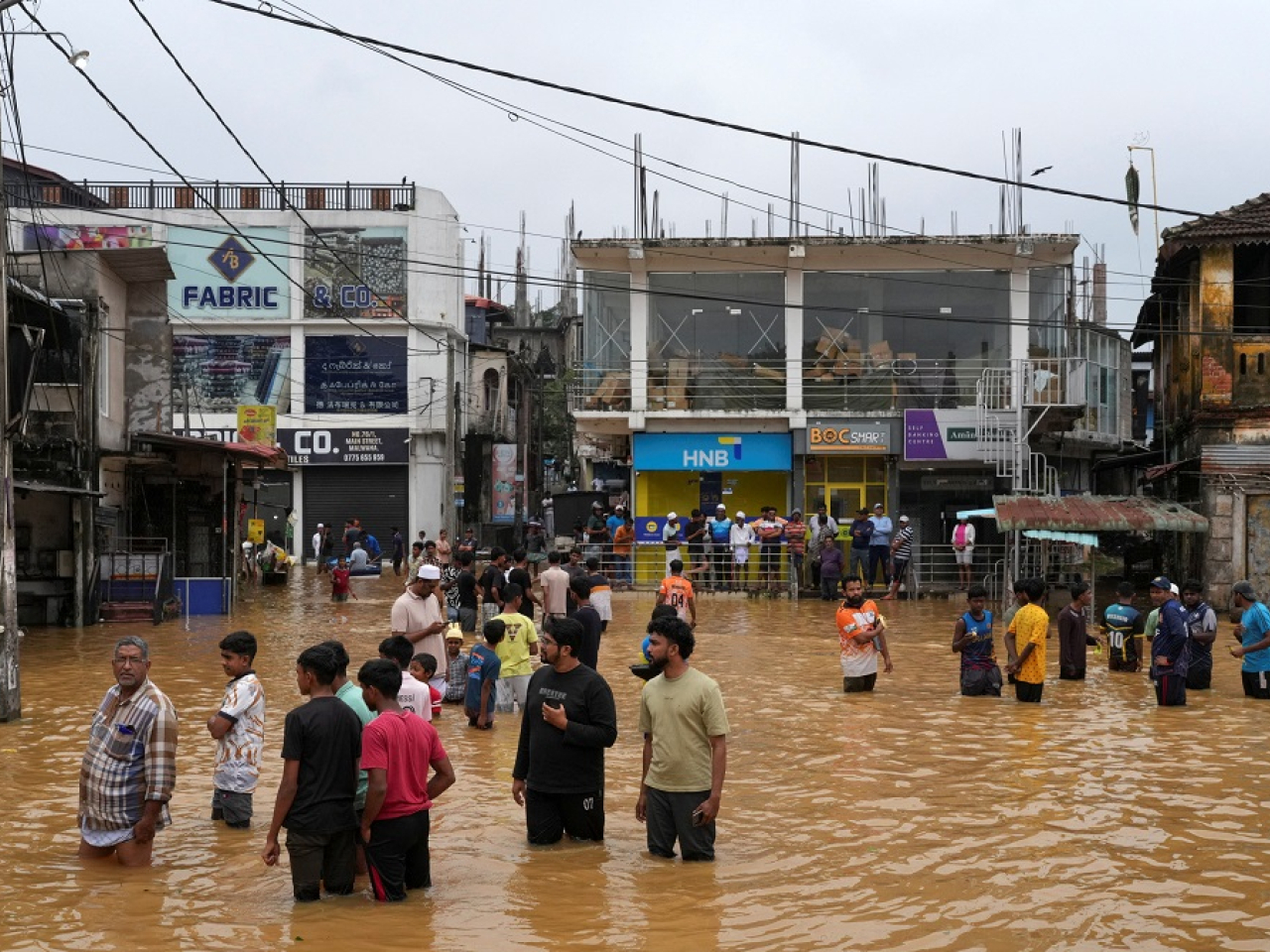People gather at an area affected by floods, following heavy rainfall in Malwana, Sri Lanka. Photo: Reuters