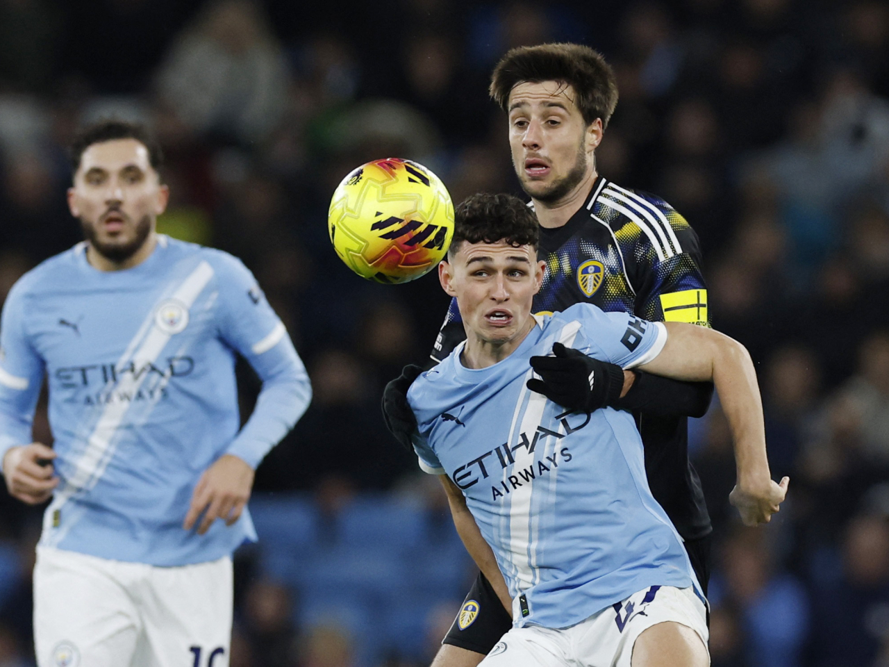 Manchester City's Phil Foden in action with Leeds United's Ilia Gruev during City's 3-2 win. Photo: Reuters