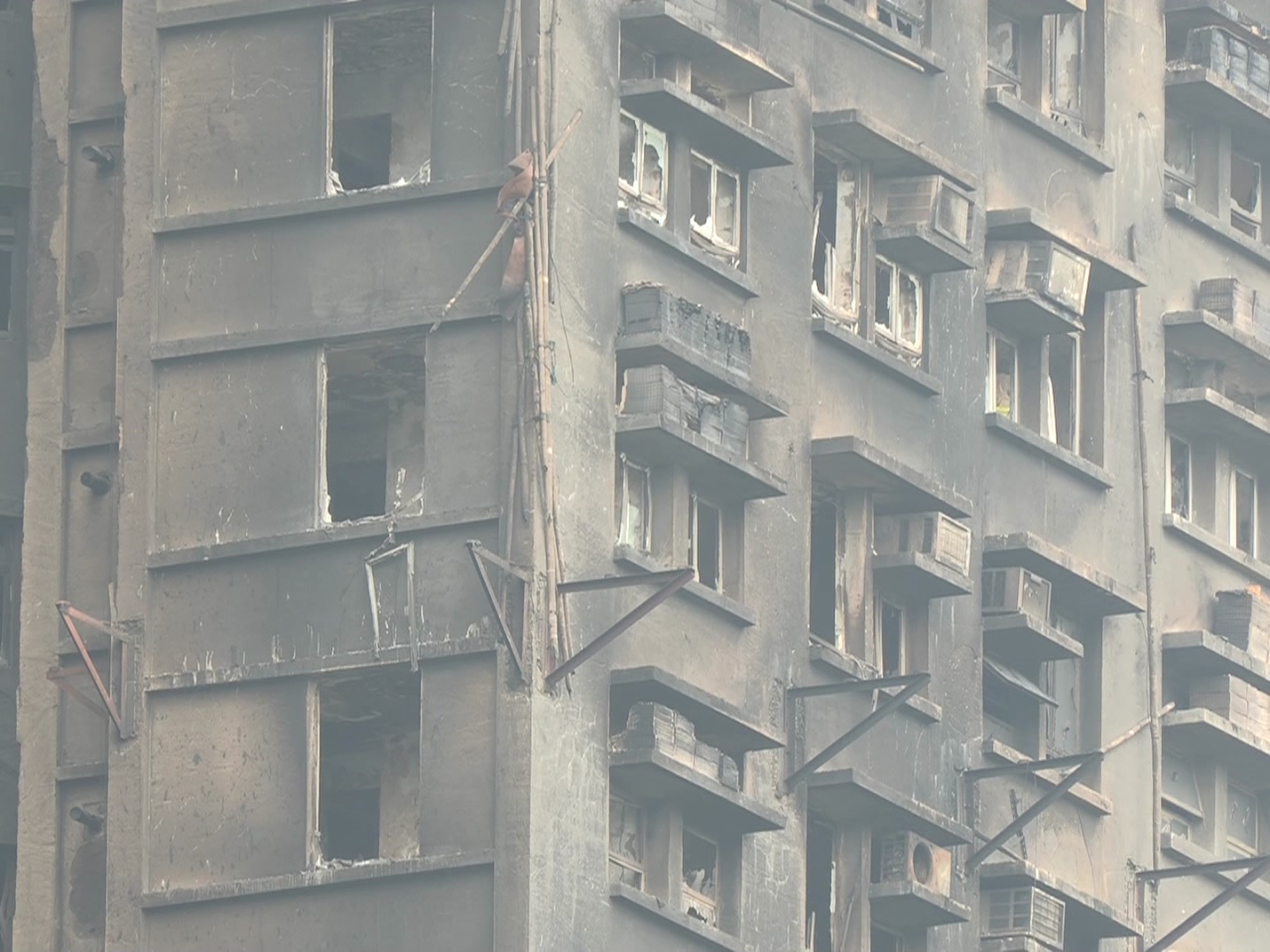 Albert Cheng said the industry is studying a requirement on minimum distance between buildings undergoing construction. Photo: RTHK