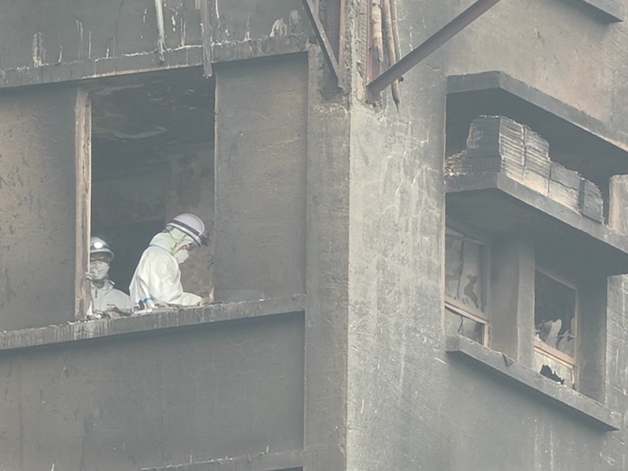 Ten foreign domestic helpers have so far been confirmed dead in the fire at Tai Po's Wang Fuk Court. Photo: RTHK