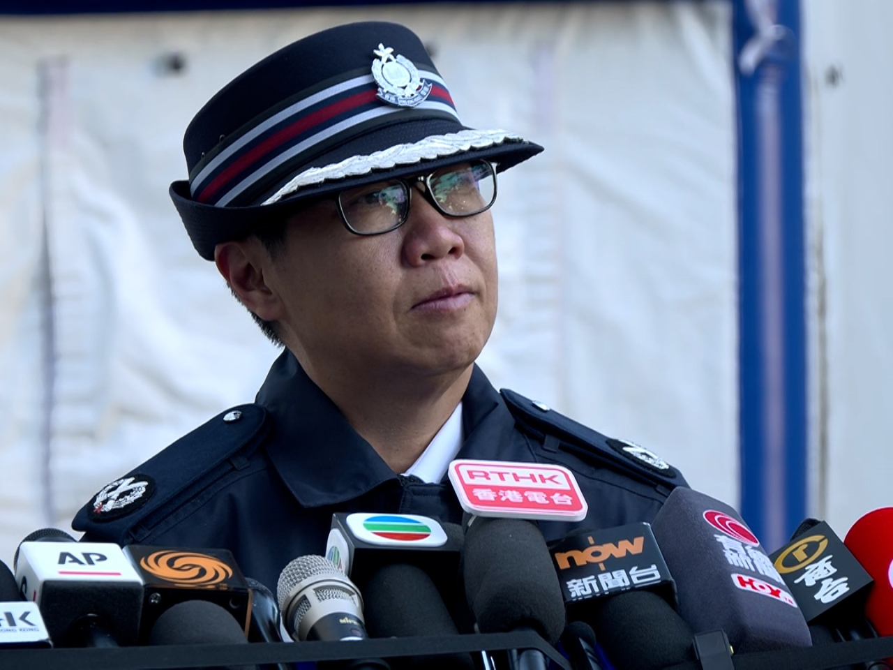 Regional commander Lam Man-han says eight bodies have been found at Wang Cheong House, with some burned beyond recognition. Photo: RTHK