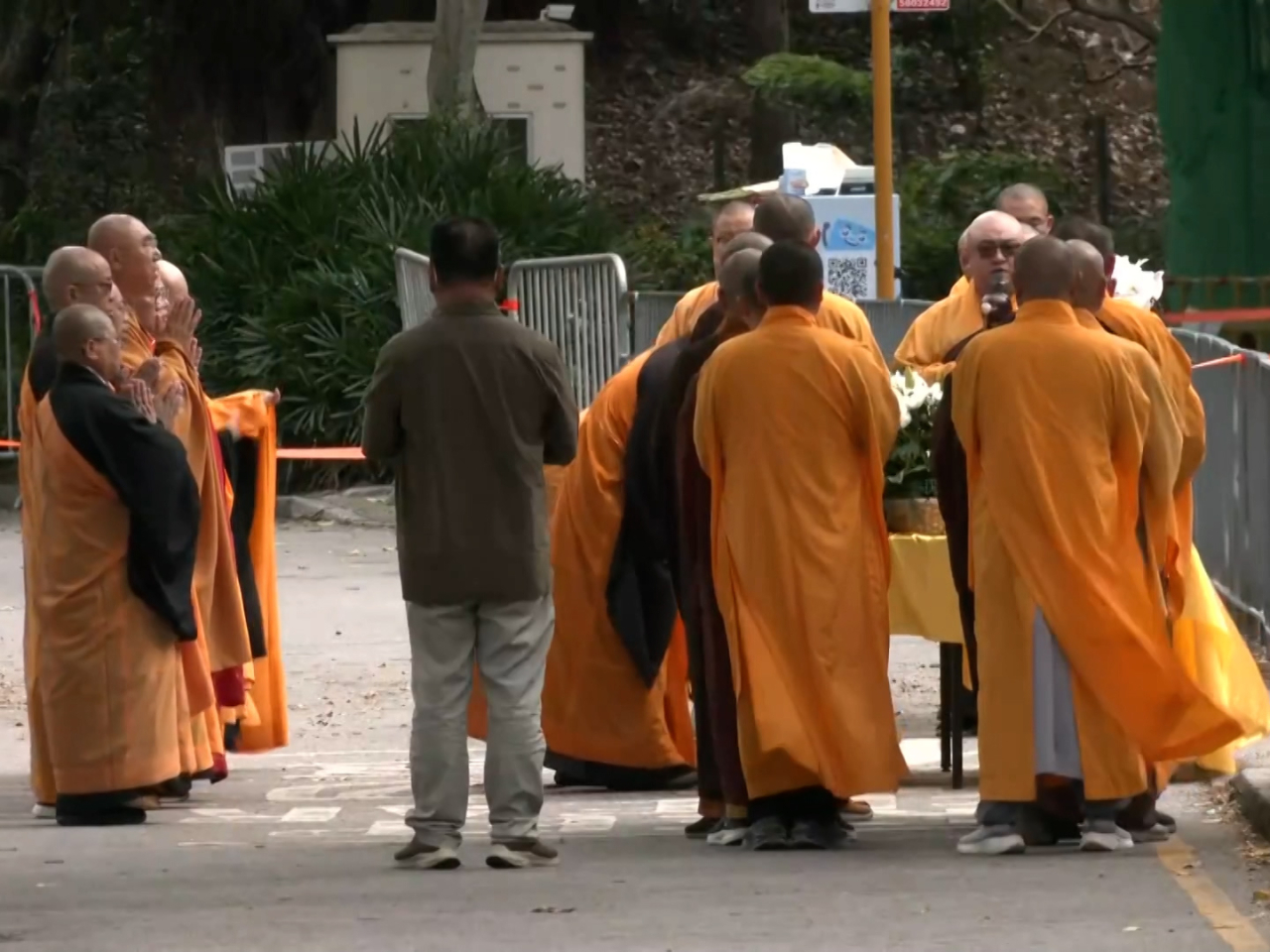 Buddhist priests hold a special ritual at Wang Fuk Court on the seventh day since the Tai Po blaze broke out. Photo: RTHK