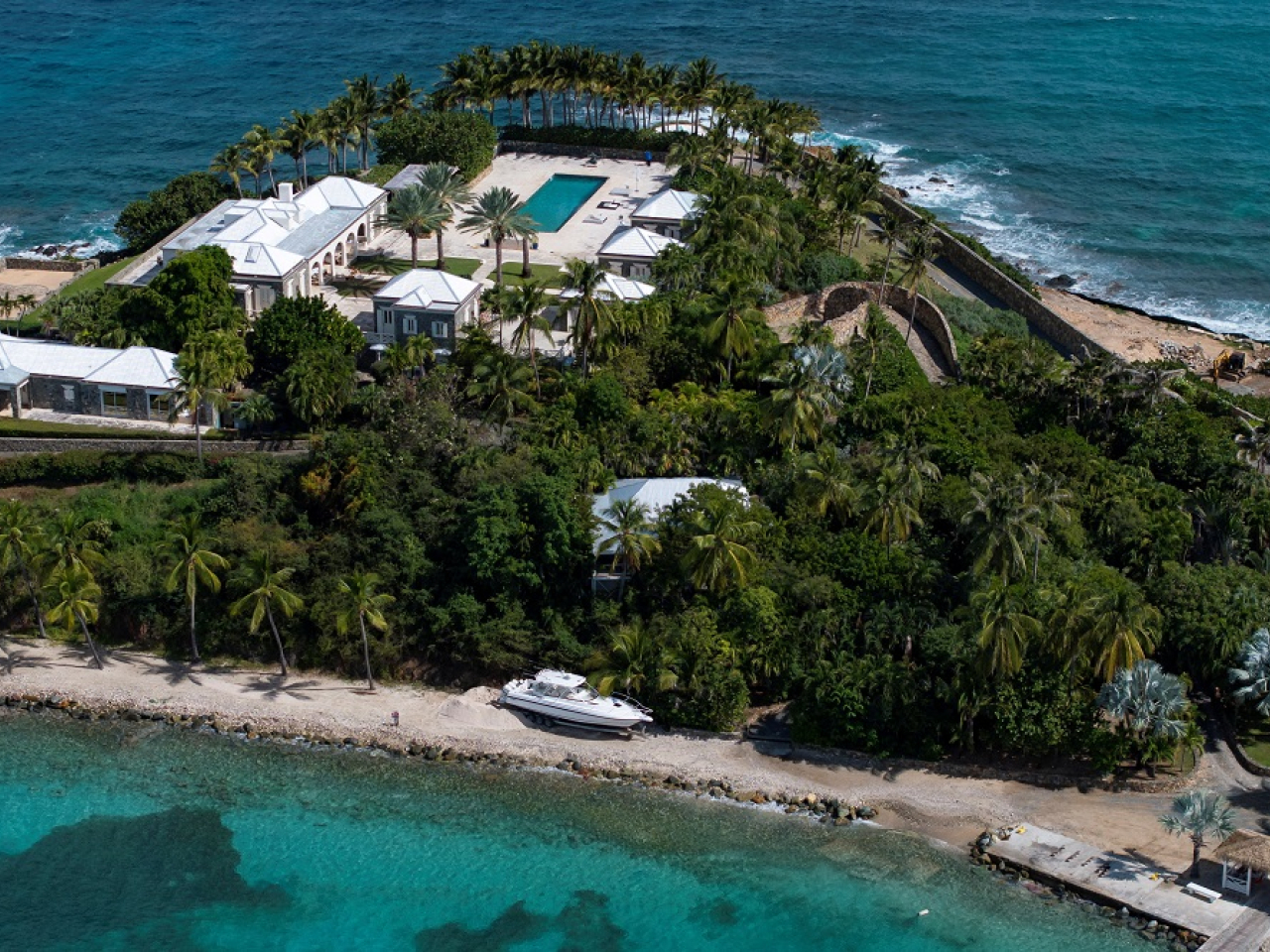 The images released by the Democrats show a luxurious villa, landscaping down to the seashore and a large outdoor swimming pool. Photo: Reuters