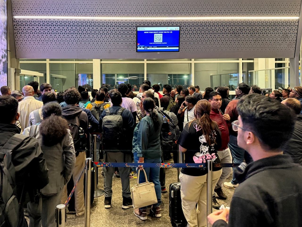 Frustrated passengers wait to board a delayed IndiGo flight at Indira Gandhi International Airport in New Delhi. Photo: Reuters