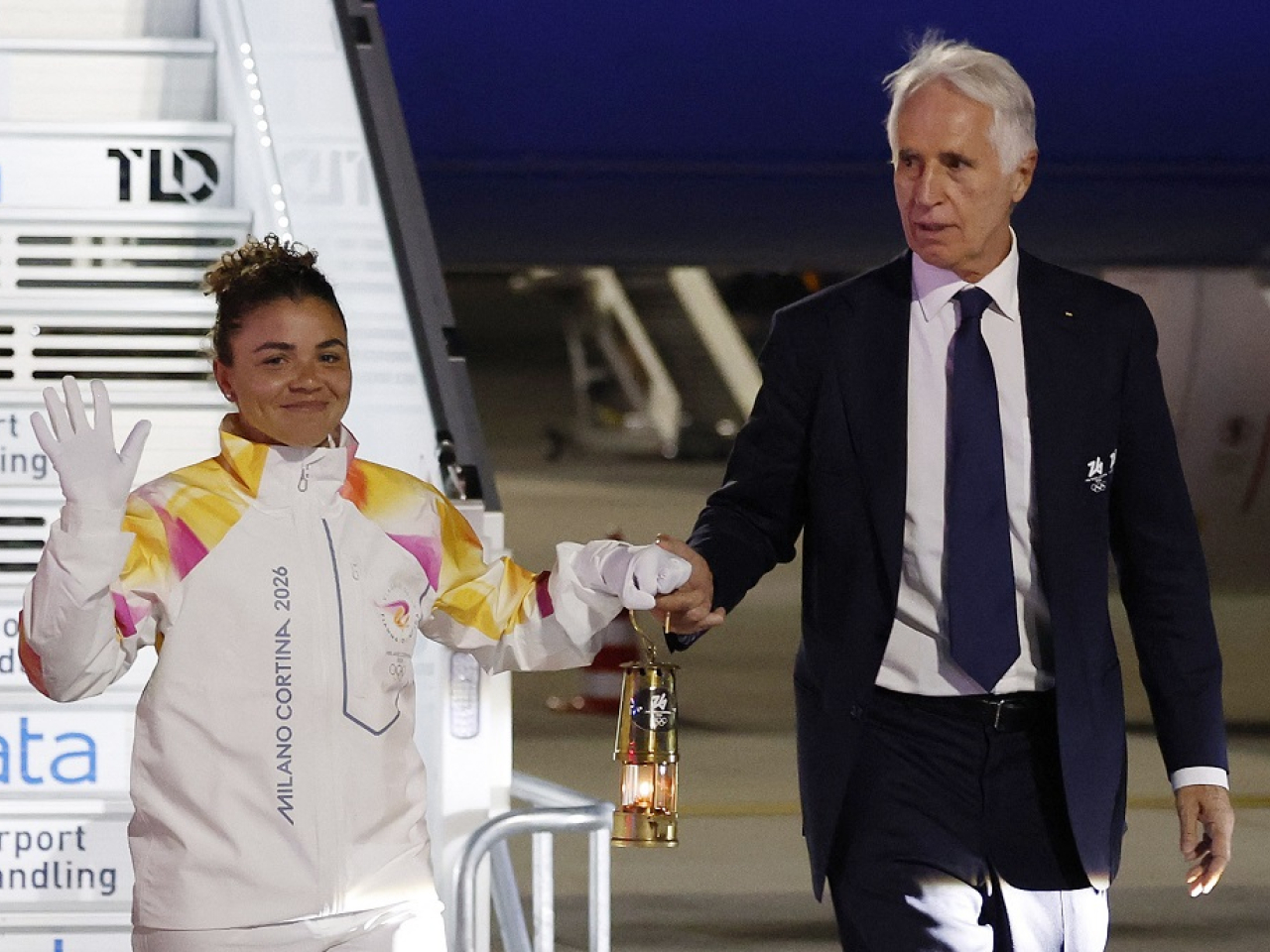 Tennis star Jasmine Paolini with the flame at Rome's Fiumicino airport. Photo: Reuters
