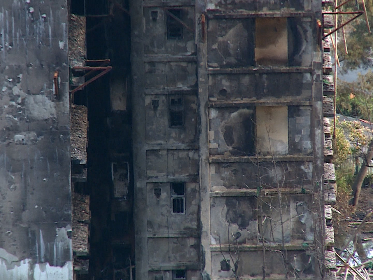 Even though some units have been gutted by the fire, Edward Chan says that does not necessarily mean the seven Wang Fuk Court buildings are unsafe. File photo: RTHK