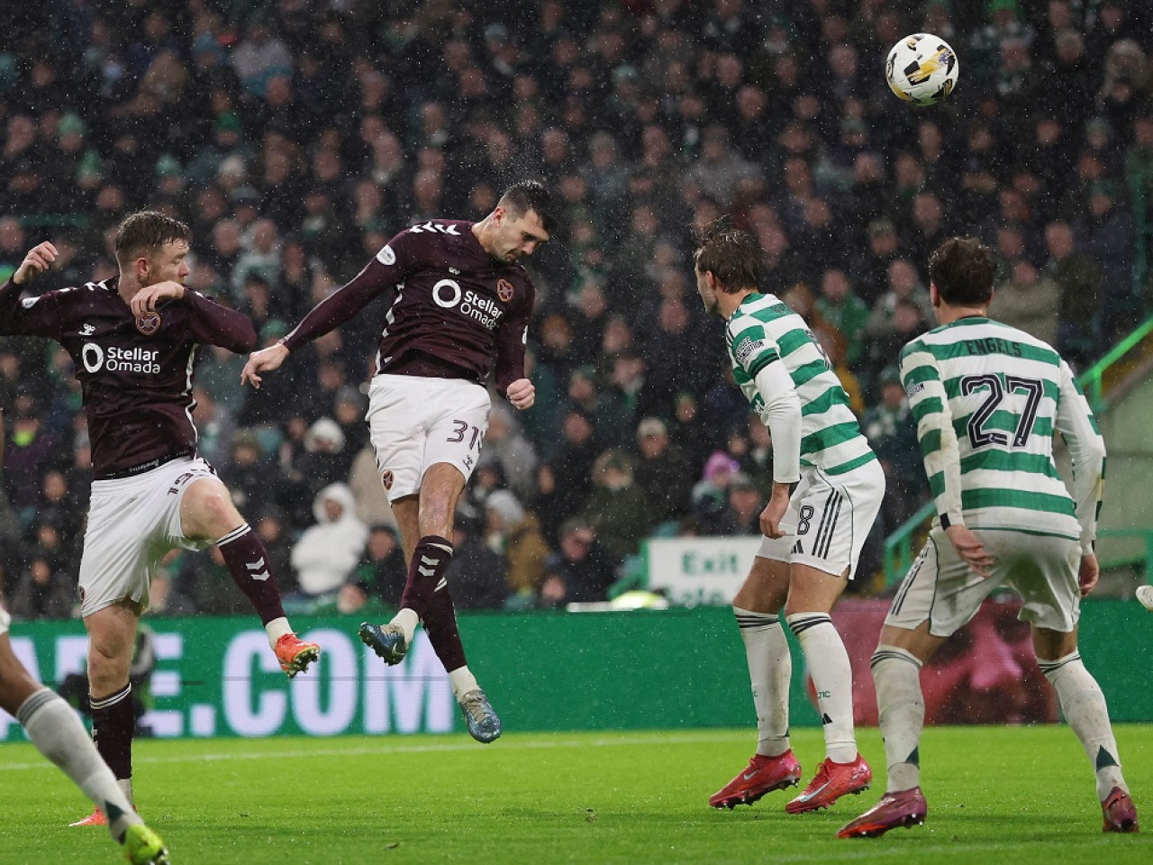 Oisin McEntee powers home Hearts' second goal to stun the home crowd at Celtic Park. Photo: Reuters