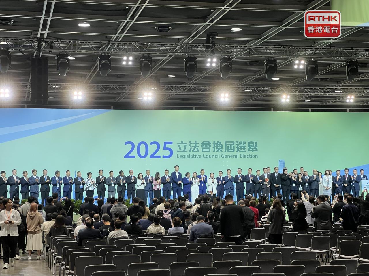 Candidates waited on stage at the election centre for the results to be announced. Photo: RTHK