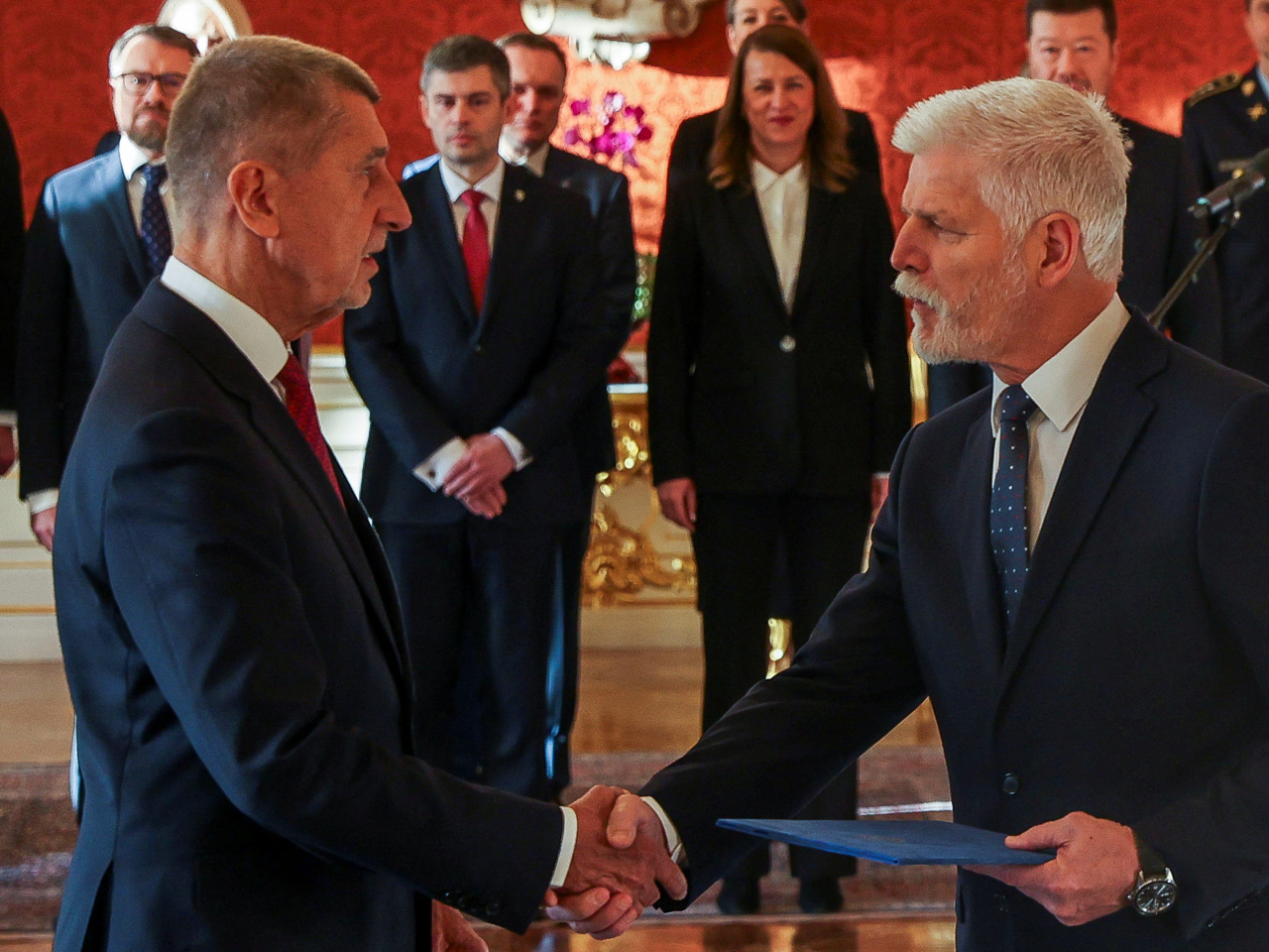 President Petr Pavel shakes hands with Andrej Babis, left, after appointing him as the country's new prime minister in Prague. Photo: Reuters