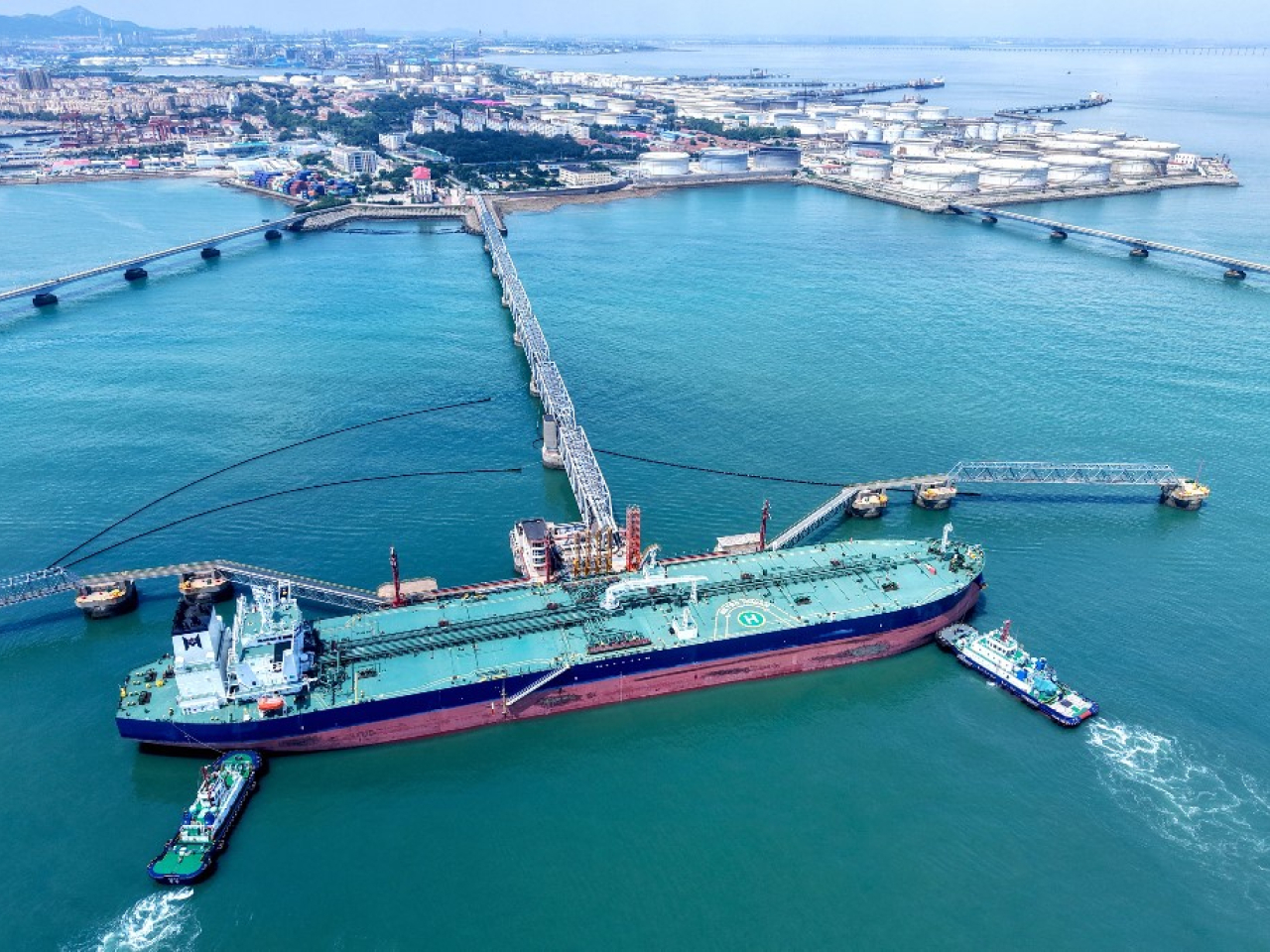 A tanker carrying imported crude docks at Qingdao Port terminal in Shandong  in August. File photo: AFP