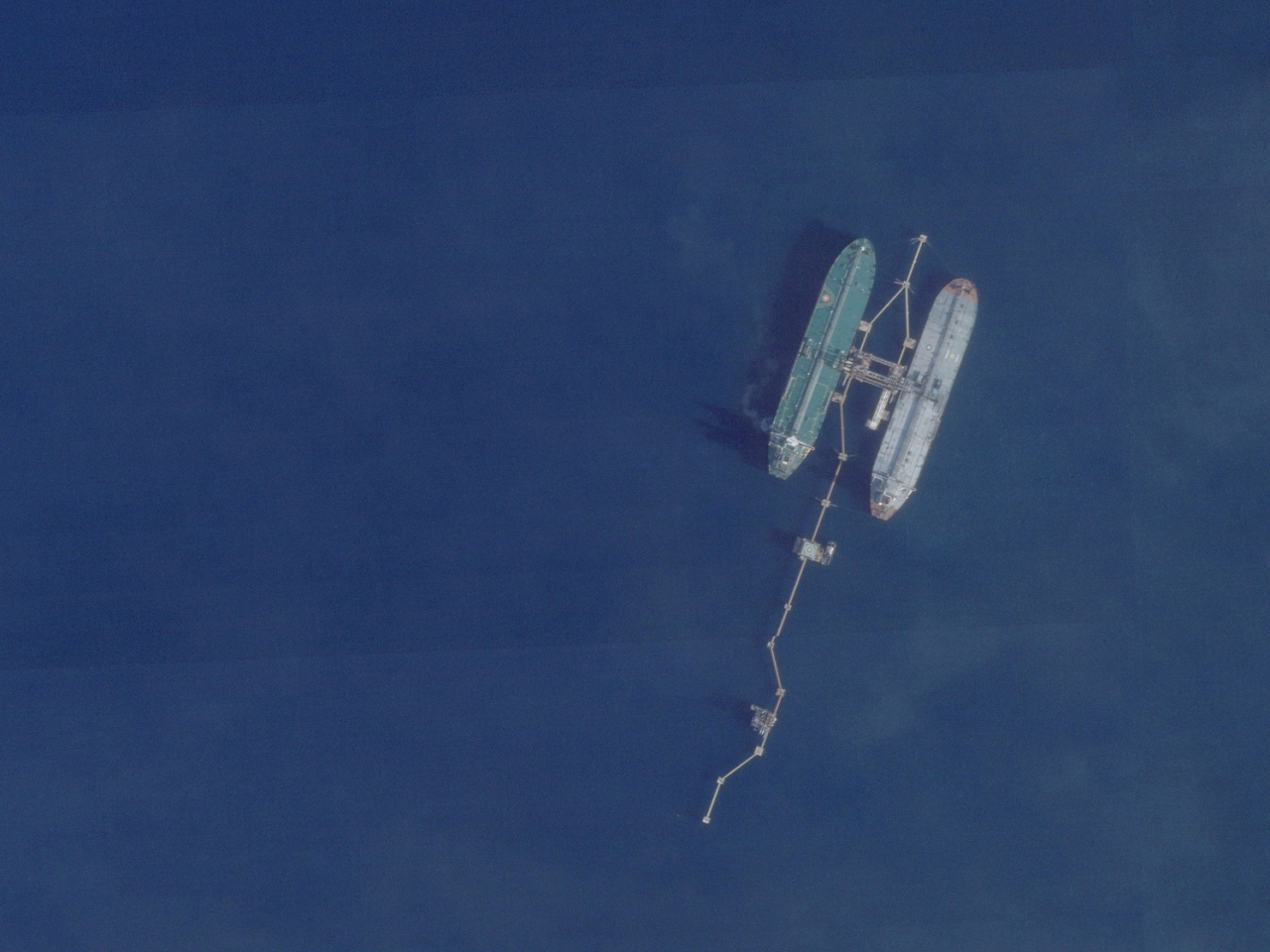 The very large crude carrier (VLCC) Skipper, seen in a satellite photo with another vessel, is said to be heading to an American port, where the oil it's carrying will also be seized. File photo: Reuters