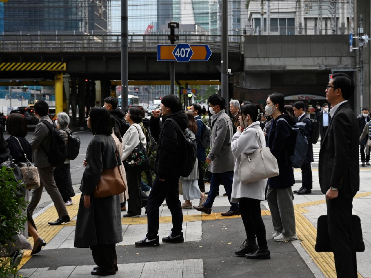 The Bank of Japan says it will 'continue to raise interest rates' if its economic and price forecasts materialise. File photo: AFP