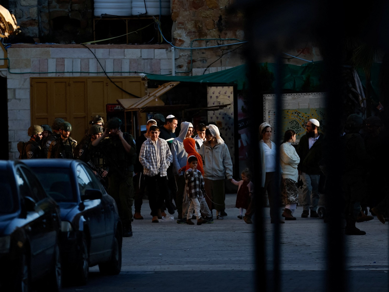 Israeli soldiers accompany setters in the West Bank town of Hebron. The number of settlements approved over the past three years in the occupied region has risen to 69. File photo: Reuters