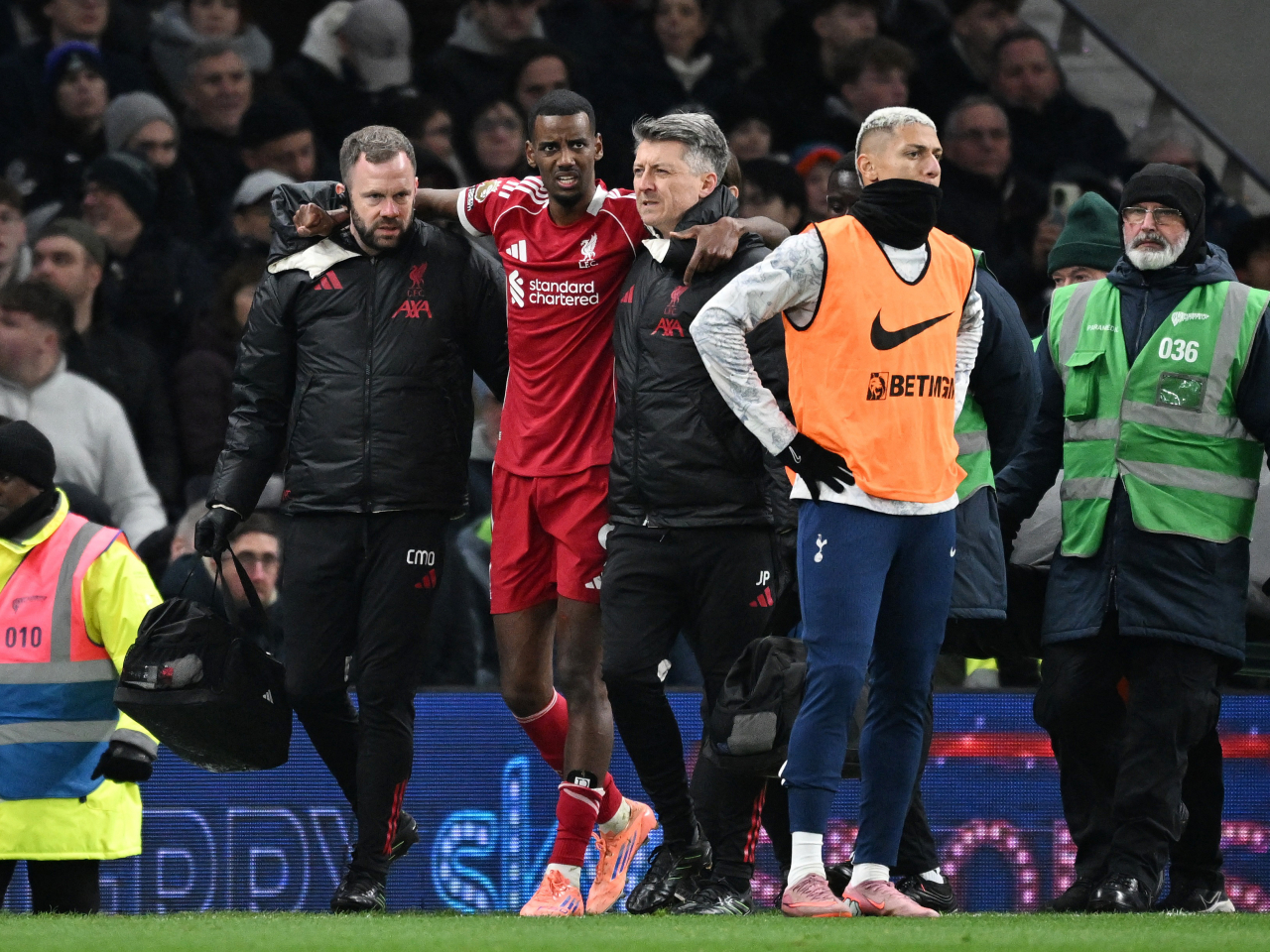 Isak was helped off the pitch moments after firing Liverpool ahead of Spurs early in the second half. Photo: Reuters