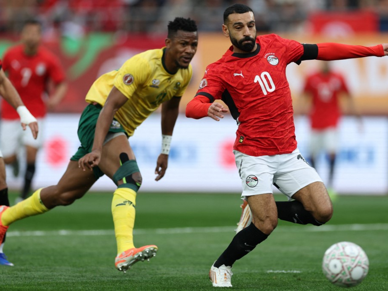Egypt's forward No. 10 Mohamed Salah, right, stretches for the ball during the Africa Cup of Nations match between Egypt and South Africa. Photo: AFP