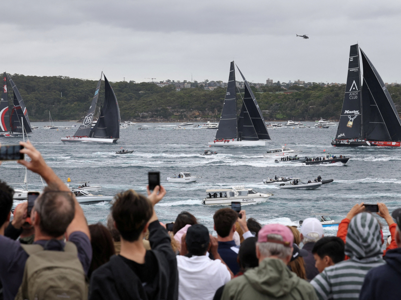 Hong Kong's SHK Scallywag 100, left, is among the supermaxis racing out of Sydney Harbour on Boxing Day. Photo: Reuters