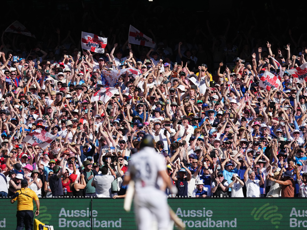 Barmy Army fans toast England's first win over Australia in nearly 15 years at Melbourne Cricket Ground. Photo: Reuters