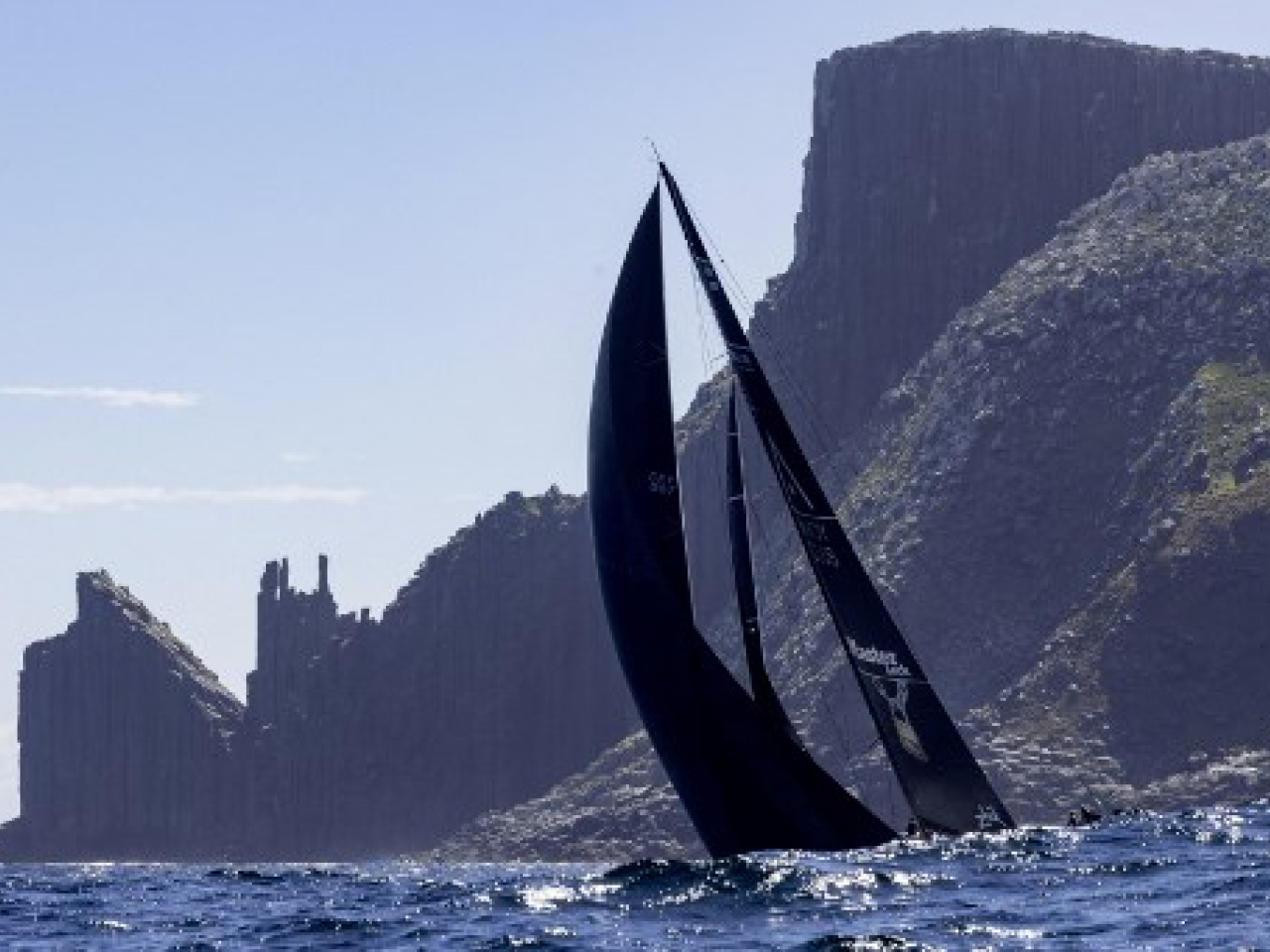 Master Lock Comanche sails near Tasman Island in the annual Sydney to Hobart yacht race. Photo: AFP/Rolex/Andrea Francolini