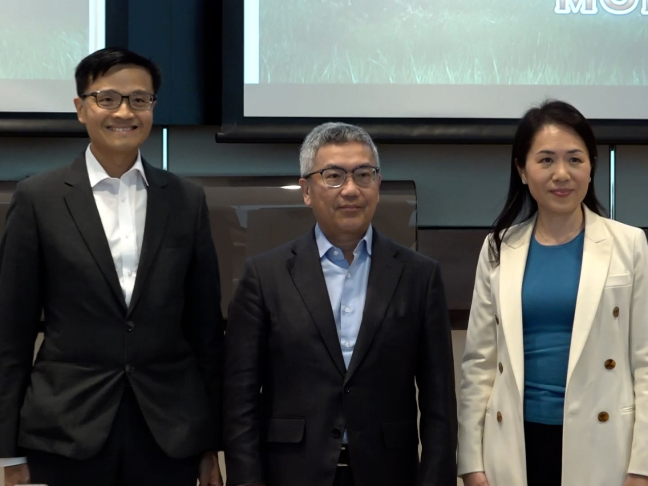 HKMA's deputy chief executive, Arthur Yuen (middle), says he hopes people of all ages will sign up for the service. Photo: RTHK