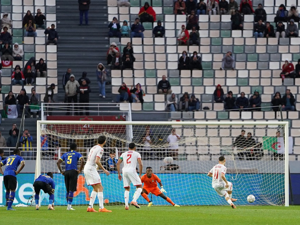 Tunisia's Ismael Gharbi gets the all-important goal from the penalty spot. Photo: Reuters