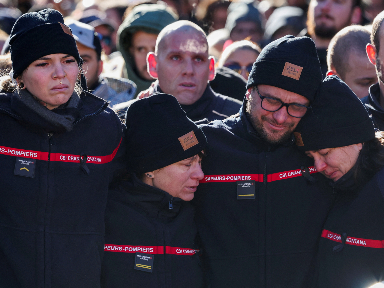 Crowds gathered at an impromptu shrine to remember the victims of the deadly bar fire. Photo: Reuters
