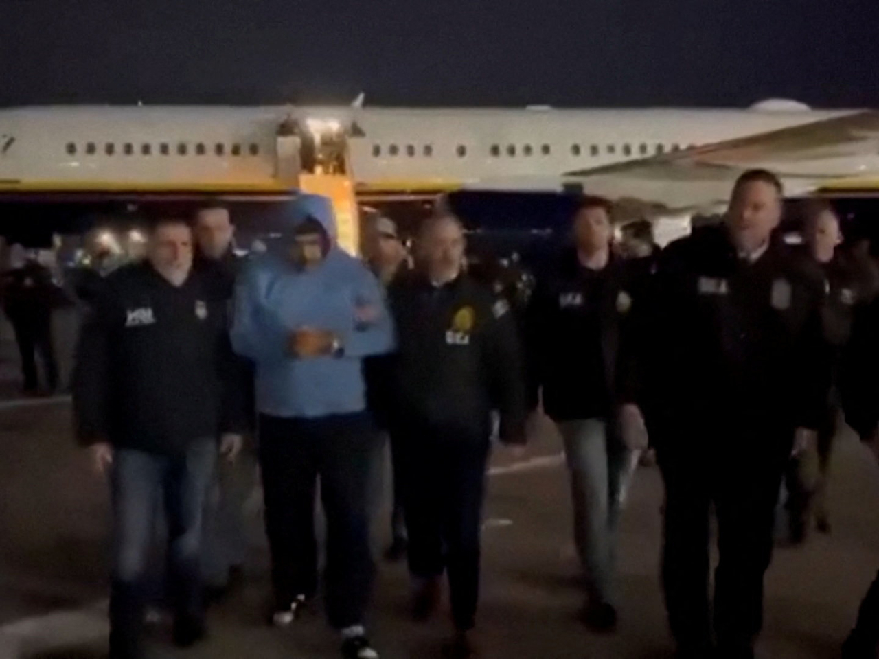 Venezuela's captured President Nicolas Maduro is led in custody from a US federal airplane at Stewart Air National Guard Base in Newburgh, New York. Image: social media via Reuters