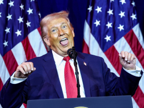 Donald Trump performed an exaggerated imitation of what he said was a transgender weightlifter even though he said his wife "hates" the "unpresidential" gesture. Photo: Reuters