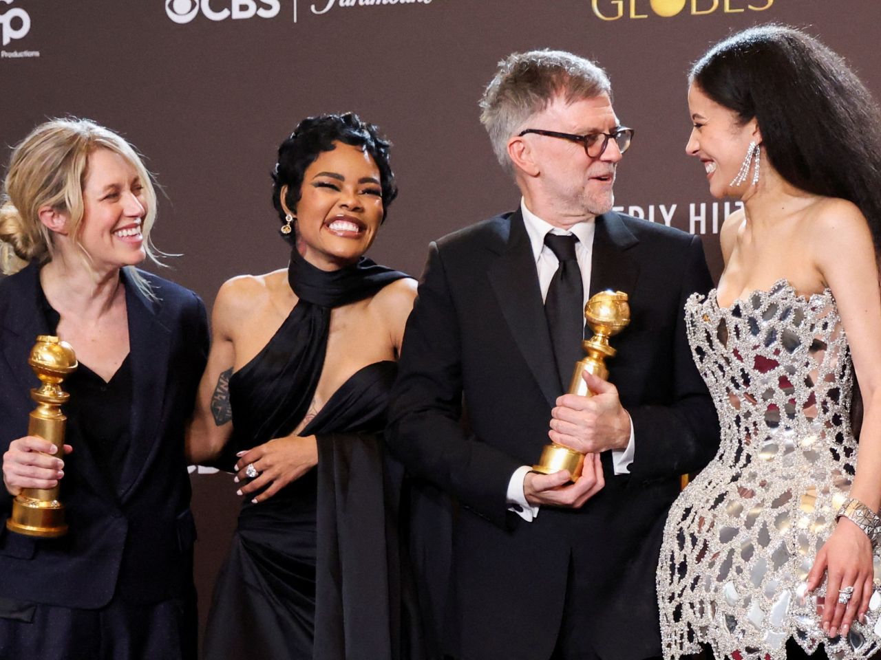 'One Battle After Another' director Paul Thomas Anderson with cast members after winning the Best Motion Picture &ndash; Musical or Comedy award. Photo: Reuters