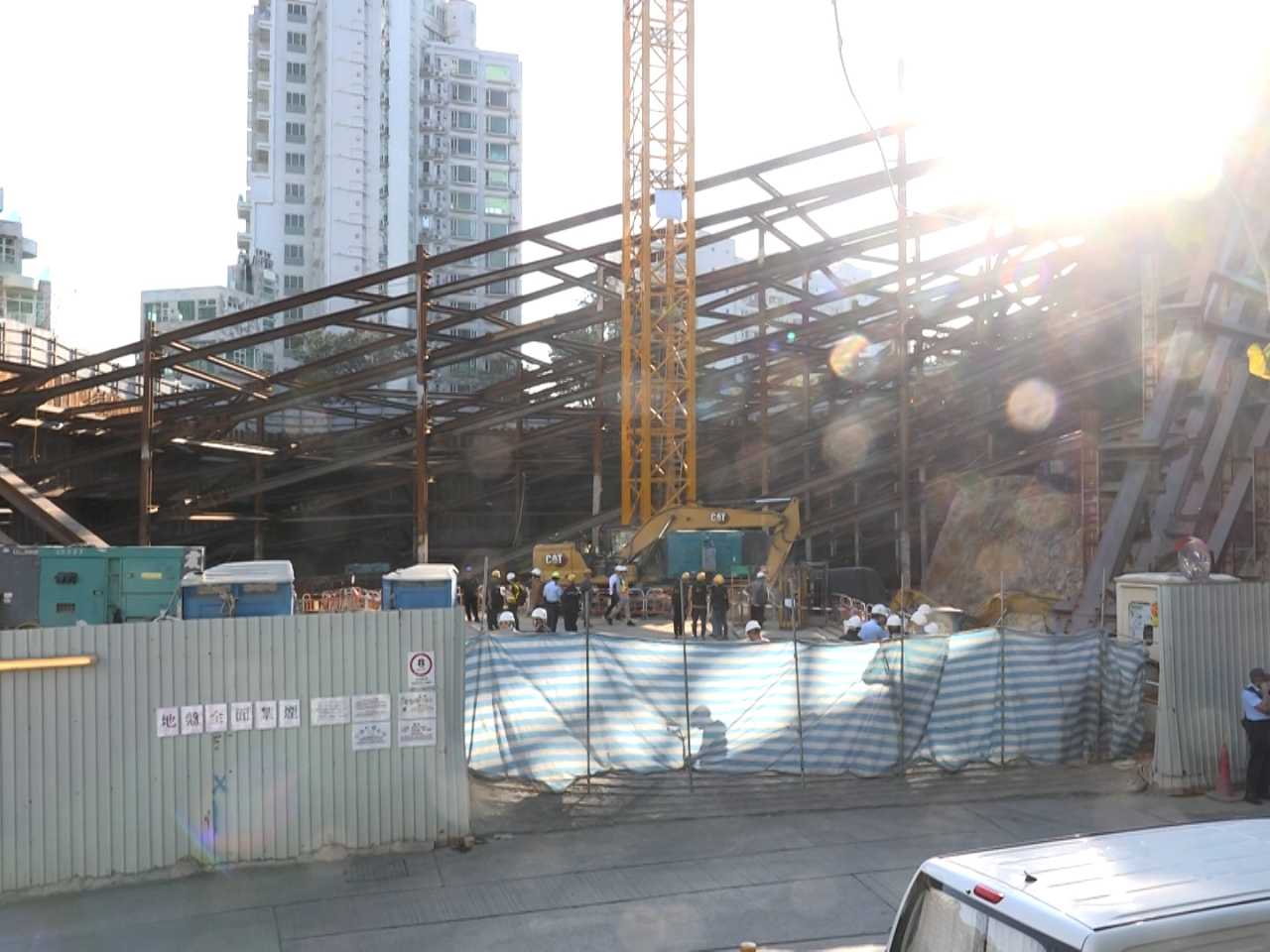 Three gas cylinders reportedly fell from a crane at a construction site on Po Fung Road in Tsuen Wan, hitting three workers. Photo: RTHK