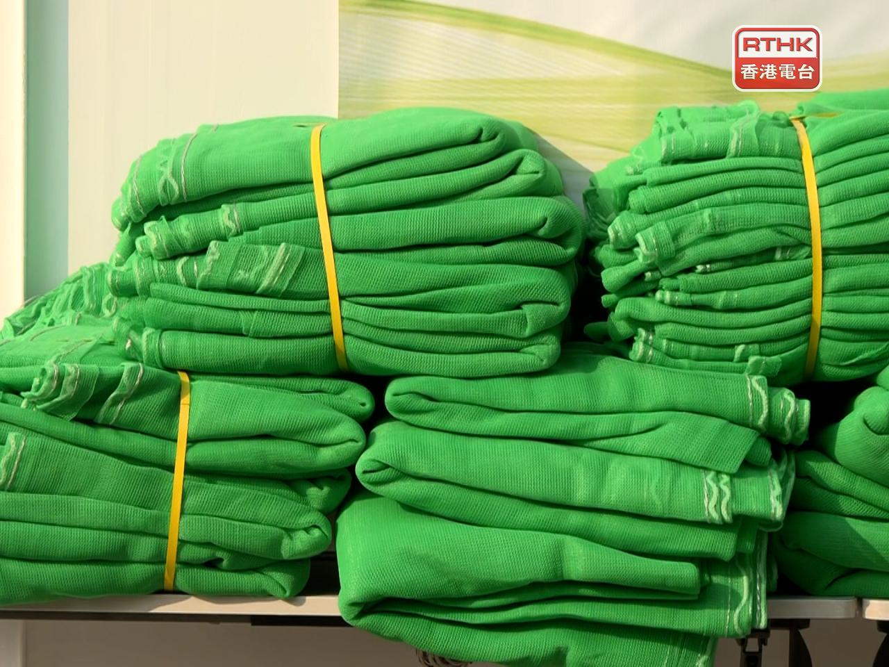 The Construction Industry Council acquired around 50,000 sheets to cover 418 building projects affected by a removal order for previous netting. File photo: RTHK