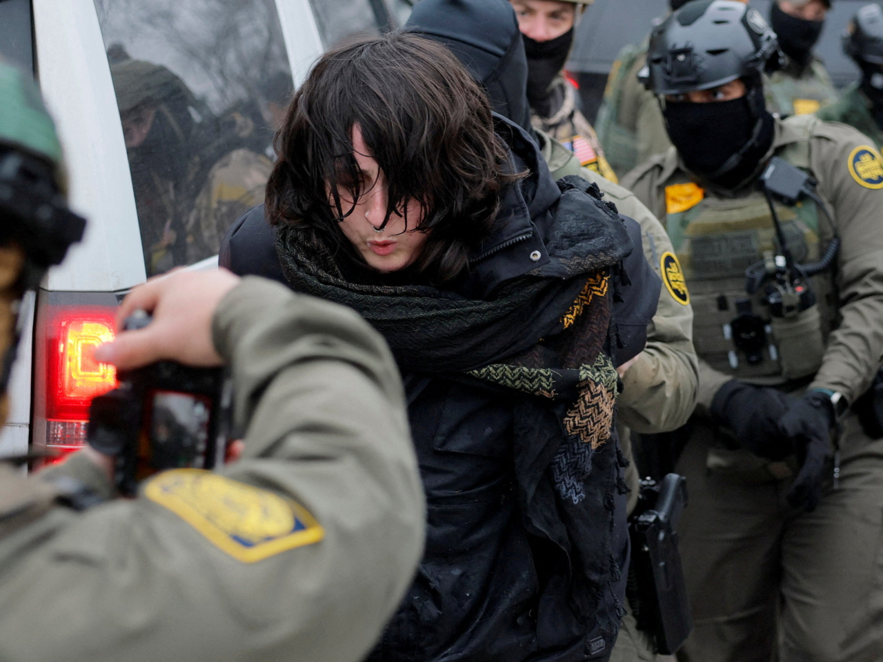 A protester is detained by Border Patrol agents in Minneapolis a day after the fatal shooting of Renee Nicole Good. File photo: Reuters