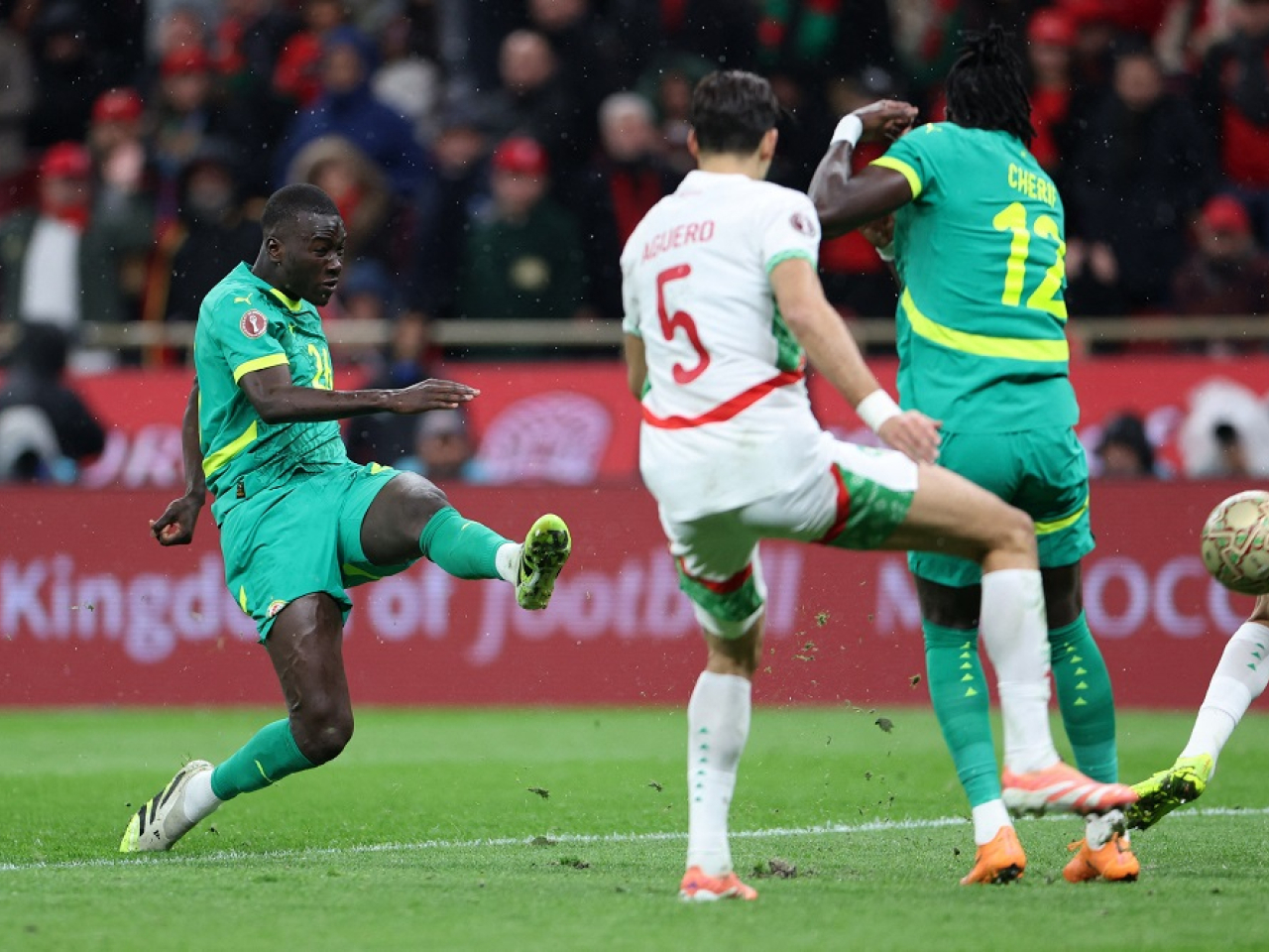 Pape Gueye rifles the ball into the top corner to win it for Senegal. Photo: Reuters