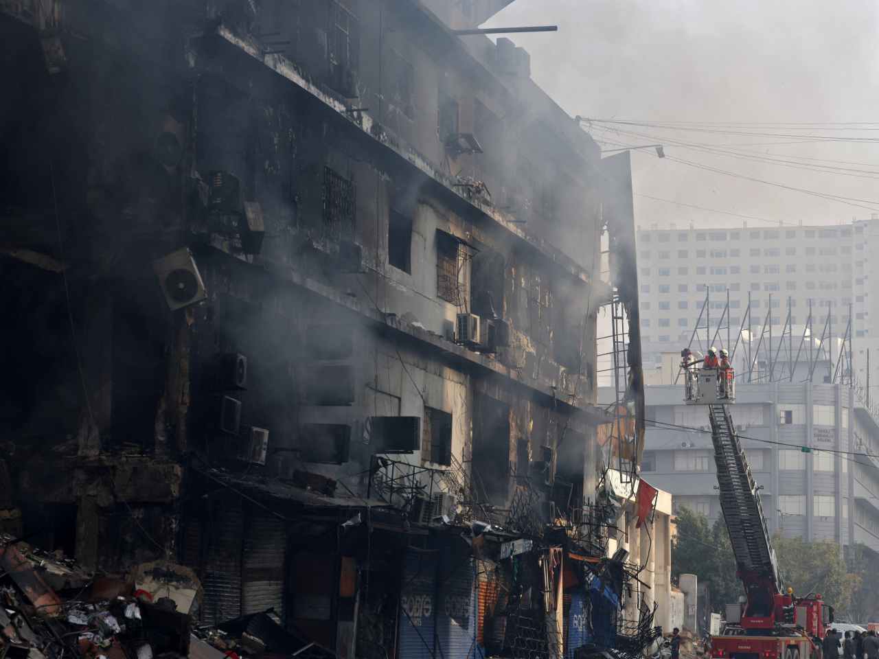 Firefighters tackle the deadly blaze in Karachi. Photo: Reuters
