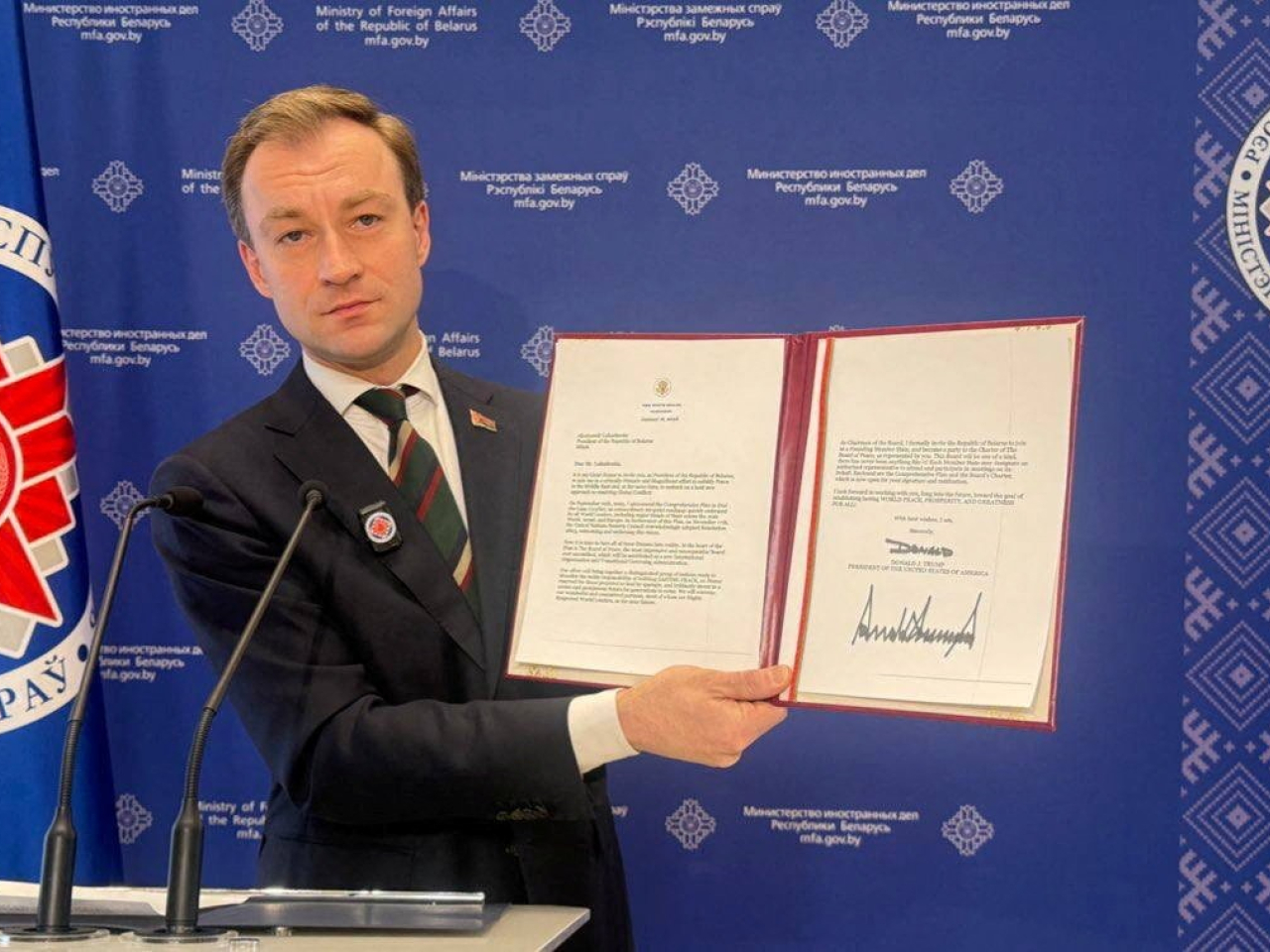 Belarus' Foreign Ministry spokesman Ruslan Varankov shows a letter from US President Donald Trump inviting President Alexander Lukashenko to join. Photo: Reuters