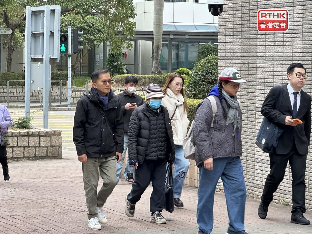 One of the survivors, Philip Chiu (left), arrives at West Kowloon Court for the inquest verdict. Photo: RTHK