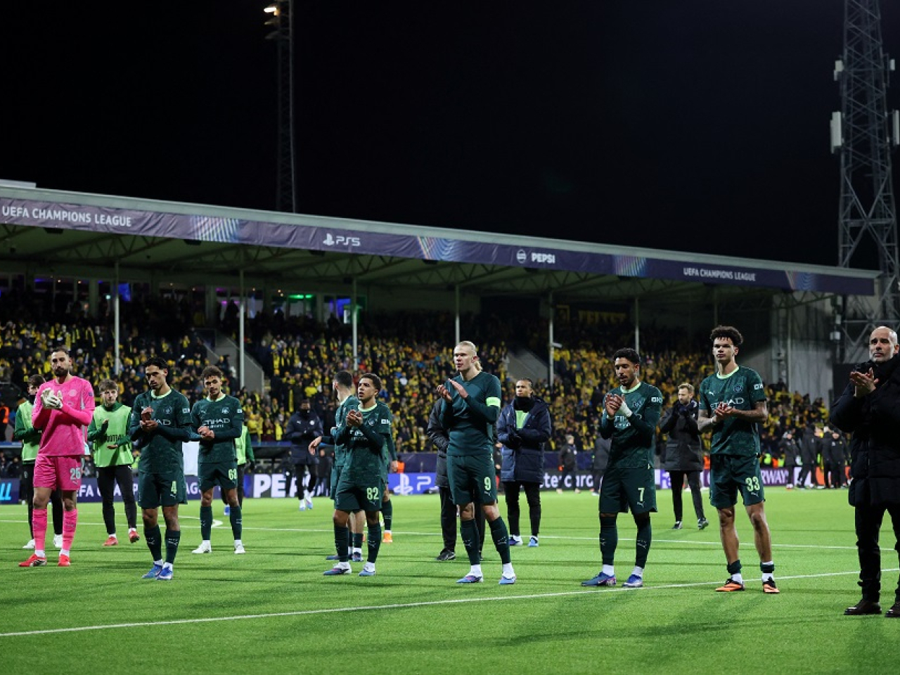 Pep Guardiola and the City team applaud the 374 die-hard fans who travelled to the Arctic Circle to watch their team get humiliated. Photo: Reuters