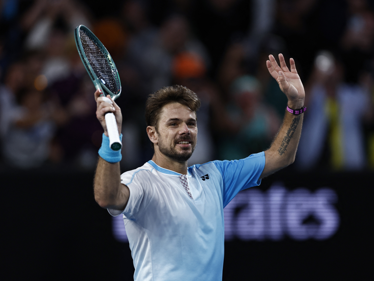 Stan Wawrinka waves to a supportive crowd in Melbourne after winning through against France's Arthur Gea. Photo: Reuters