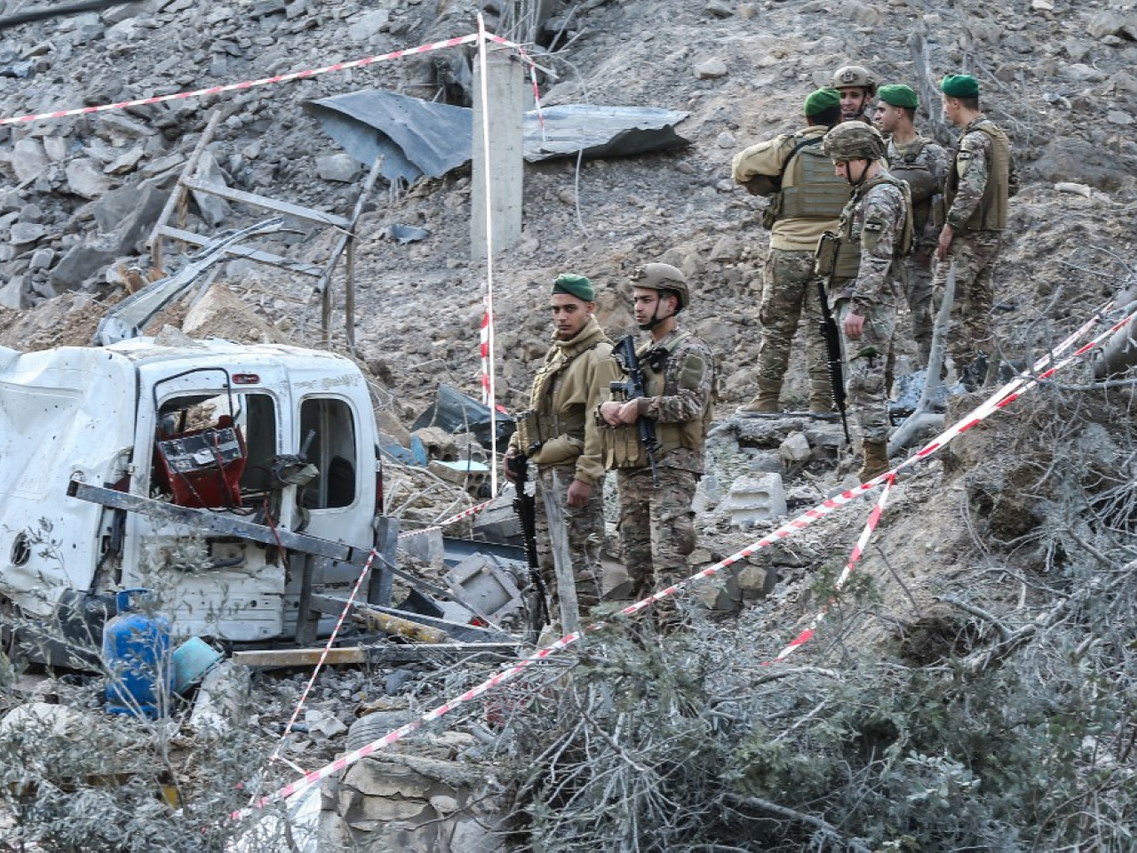 Lebanese soldiers inspect the site of an Israeli air strike on Sunday. Photo: AFP