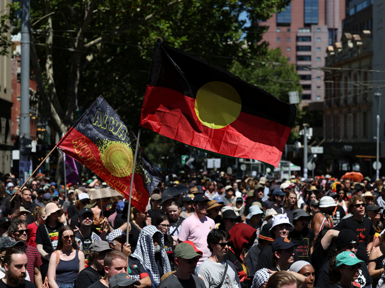 Large crowds braved a heatwave across much of the country to demonstrate on the national holiday, which marks the 1788 arrival of a British fleet in Sydney Harbour. Photo: Reuters