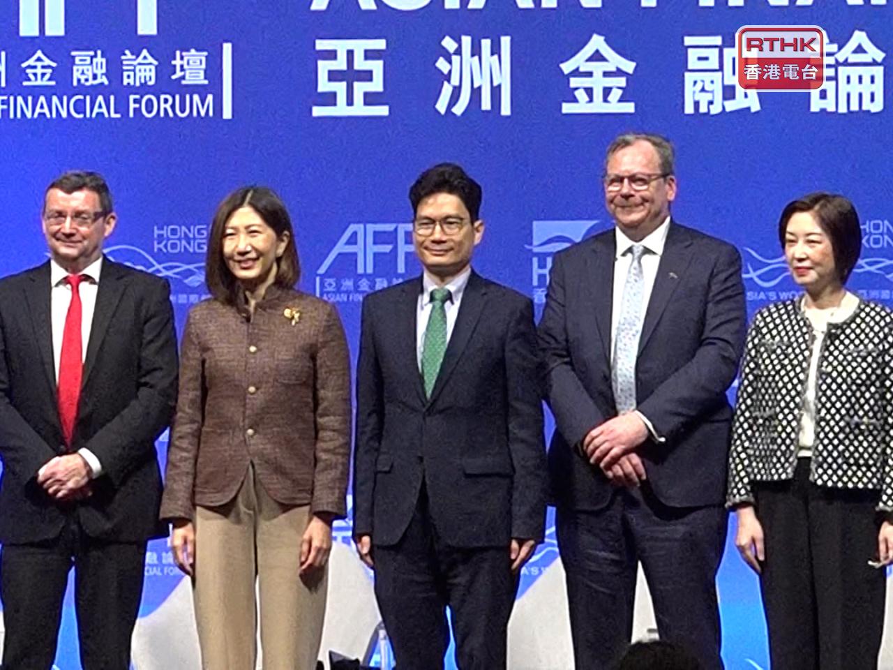 HKEX chief executive Bonnie Chan (second left) says the city's bourse operator will look to invest more in technology. Photo: RTHK