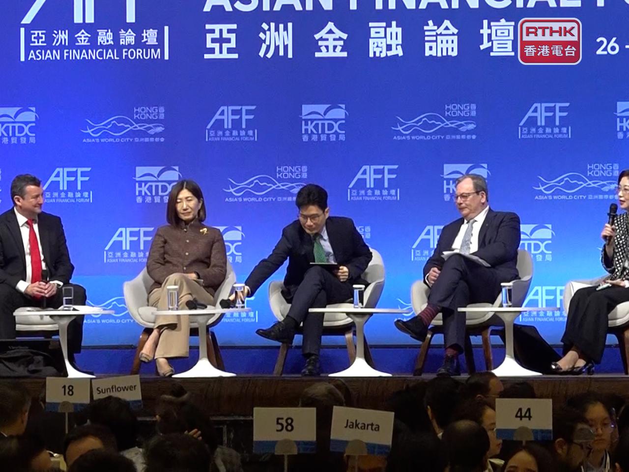 Jerry Zhang (right) says the HKMA's move to double yuan funding under last year's swap facility can aid renminbi internationalisation. Photo: RTHK