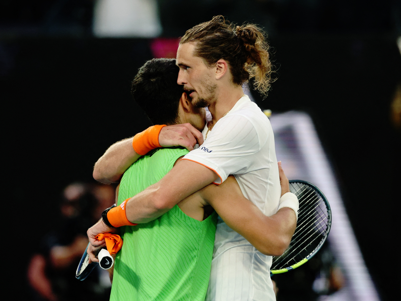 Alexander Zverev hugs Carlos Alcaraz at the end of their marathon five-setter in Melbourne. Photo: Reuters